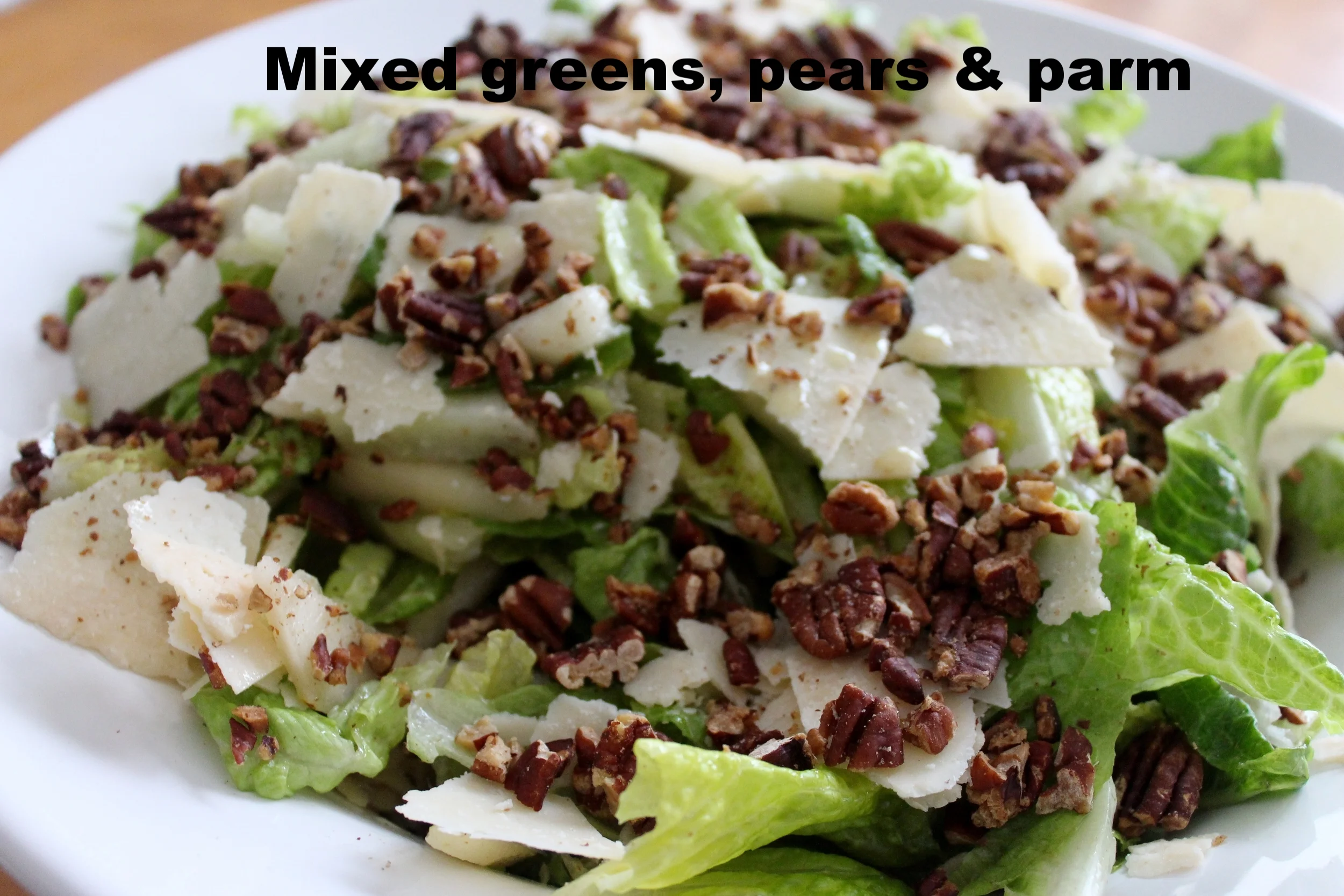 Mixed greens with pears , toasted pecans and shaved parmesa
