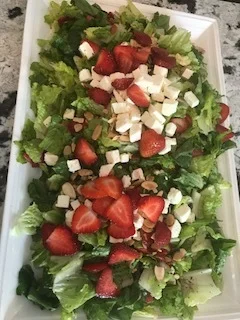 Mixed greens with strawberries, feta cheese , toasted almonds