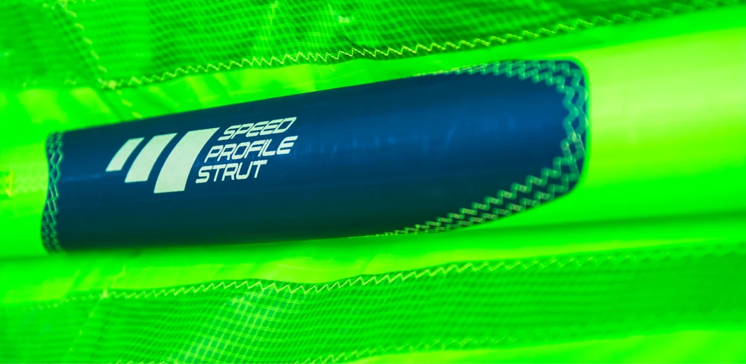 ELLIPSE SEGMENTED STRUT For 2018 we implemented a brand new Ellipse Segmented Strut construction and connection to the canopy of the kite. The strut is split into three segments with an ellipse like cut. Only the segment connected to the Leading Edge has the center seam on the outer side. The top two thirds are vertically. We used the seam connecting the struts to the canopy to close the struts at the same time. These result in better profile of the strut and much more strength in the struts.
