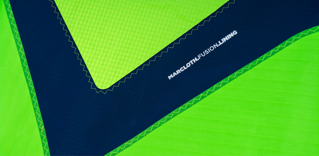 MARCLOTH FUSION LINING Our engineers use Marcloth to strengthen all areas where the heavy duty kite frame materials meet the lightweight canopy. Marcloth is a mid-weight high strength fabric, ideal to create the ultimate fusion between the higher weight and lighter weight fabrics. All transitions between the frame and canopy are in round shapes, rather than sharp angles and straight lines, as the round shapes spread tension more evenly. Of course, this increases the durability of the kite.