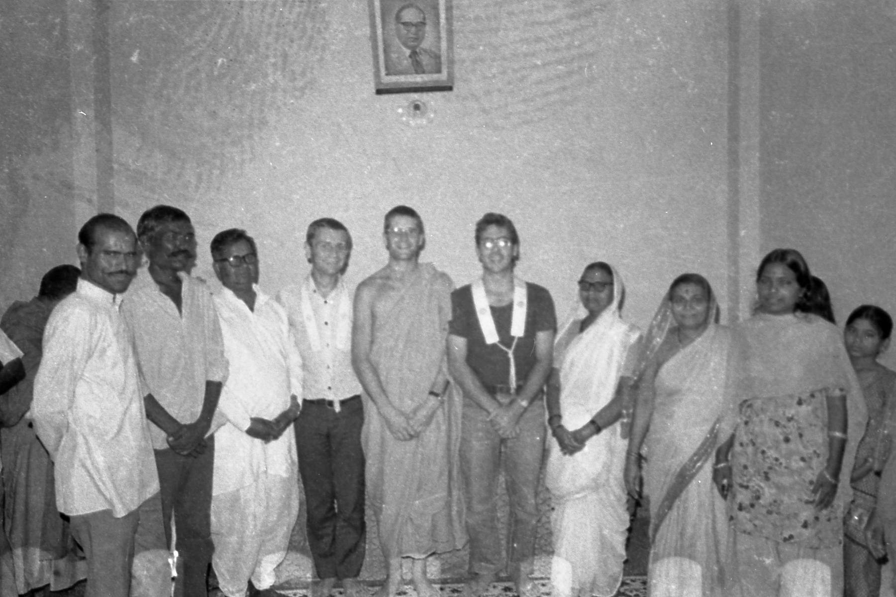 This is a picture taken in Ambedkar societyin Pune, where we had our office. Your mother is there…can you recognize her? She must have been around 20 then. At that ceremony she became what we call a Mitra. She wanted to formally associate with us and involve herself in deeper spiritual practice. She was very determined. Her family was very poor, her father working but not getting very much for it. The very large man in the picture is Shakyanand, who worked with us. A real character. He would eat 7 meals a day, and everyday for lunch he’d bring a big dabba, a tiffin box that he’d always share around with us. When he retired properly he became a monk and travelled all the time, not staying in any place for more than 3 days. He was old, had diabetes, had absolutely everything wrong with him, but he’d just keep going . The one next to your mother is Mrs. Wanshil, who sold vegetables outside her house everyday. Her husband would sometimes bring up to thirty people to our meditation classes! All his children, grandchildren, nephews and nieces! Just gives you a sort of idea of the people we were working with.