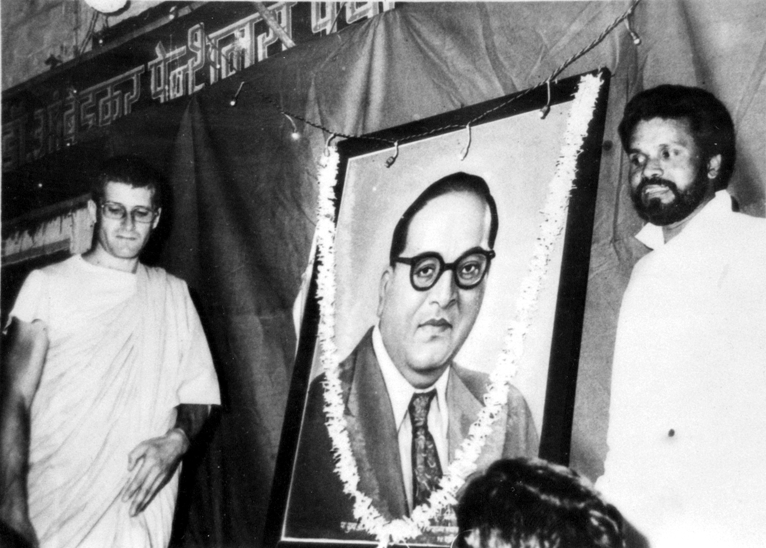 Ambedkar had converted to Buddhism in 1956. He’d been born an untouchable and he suffered a great deal in his childhood from untouchability, and struggled to get an education, but he managed to become one of the first untouchables to matriculate. With help from progressive leaders like the Maharaja of Kolhapur he finished his education abroad in America, at Columbia, studying under John Dewey, and then in England and Germany too. He came back one of the most educated people in India at that point but couldn’t get a job in government service because of his status as an untouchable. That started his social career. He was intelligent, educated, had worked in Politics, Law, and Economics, and brought about lots of reforms in these areas, especially for the so-called untouchables. 