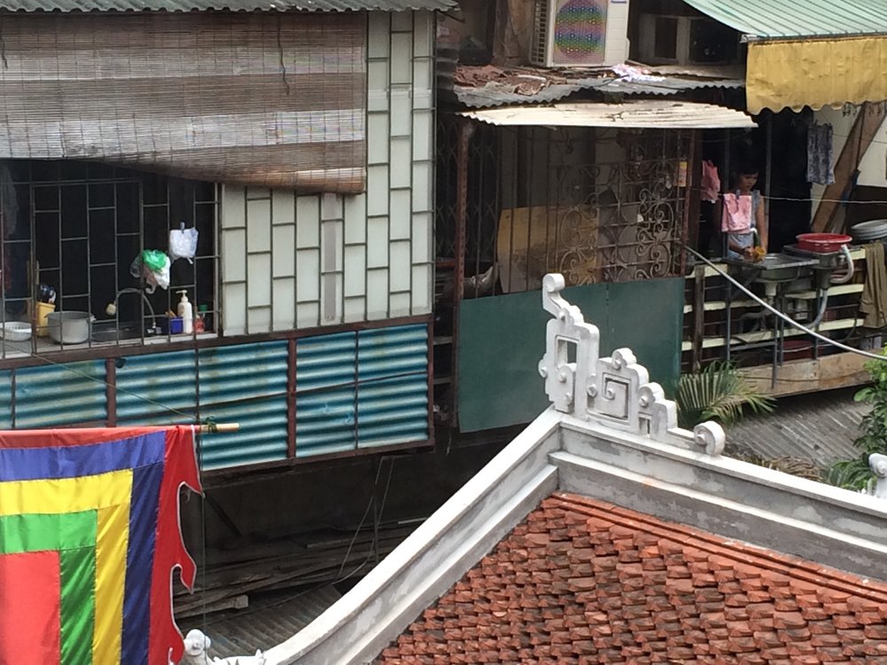 Kitchens hanging on the outside of homes in Hanoi