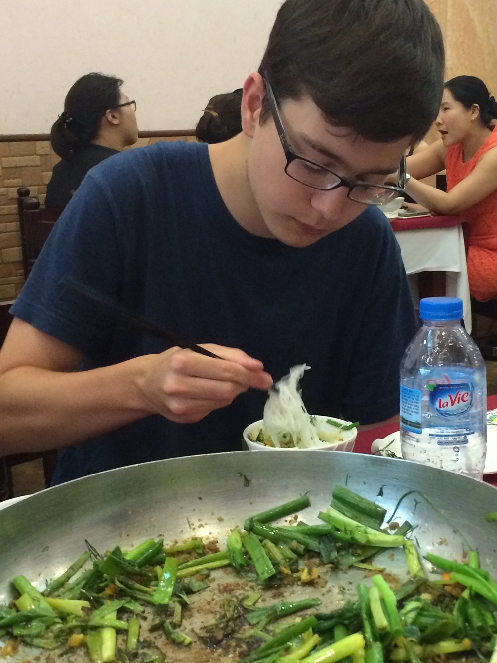 In Hanoi, the family-style food is often scooped onto fresh rice noodles