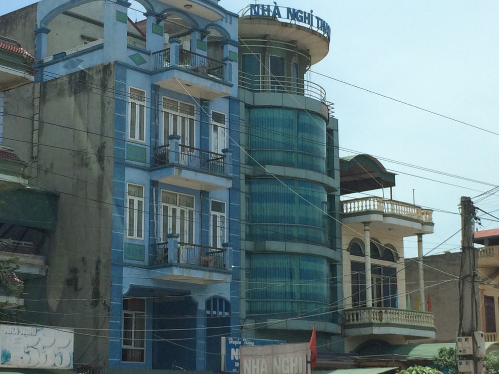 Houses in the Vietnamese countryside had fancy fronts, unadorned sides, and backs that fronted large gardens or rice patties.