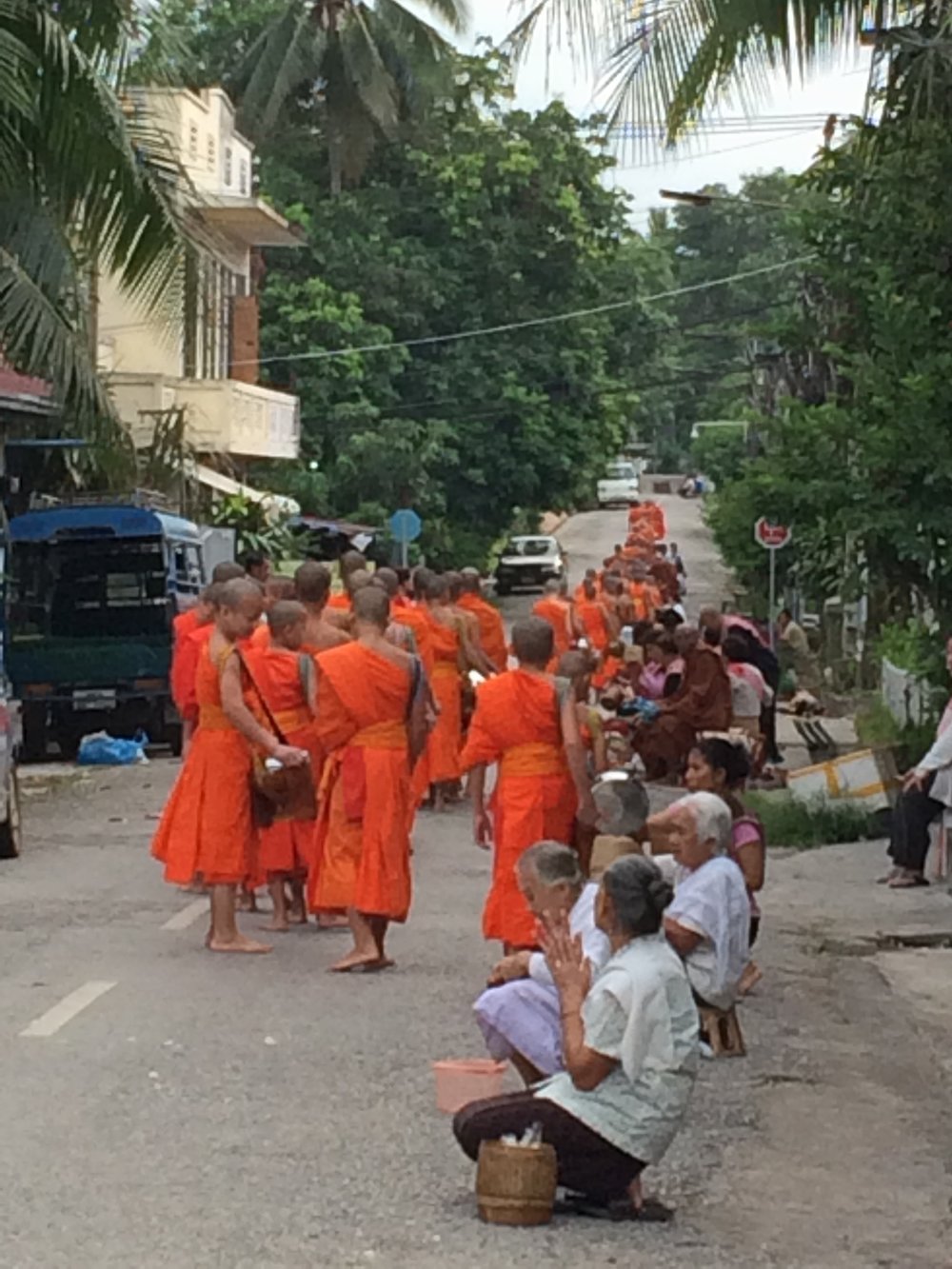 Monks collecting alms