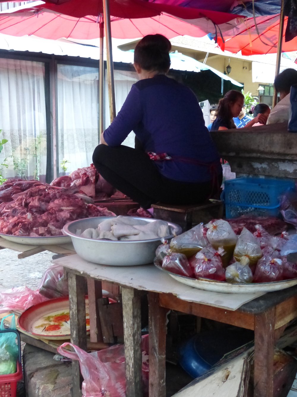 Wait, and butchers get up on the table in Laos?