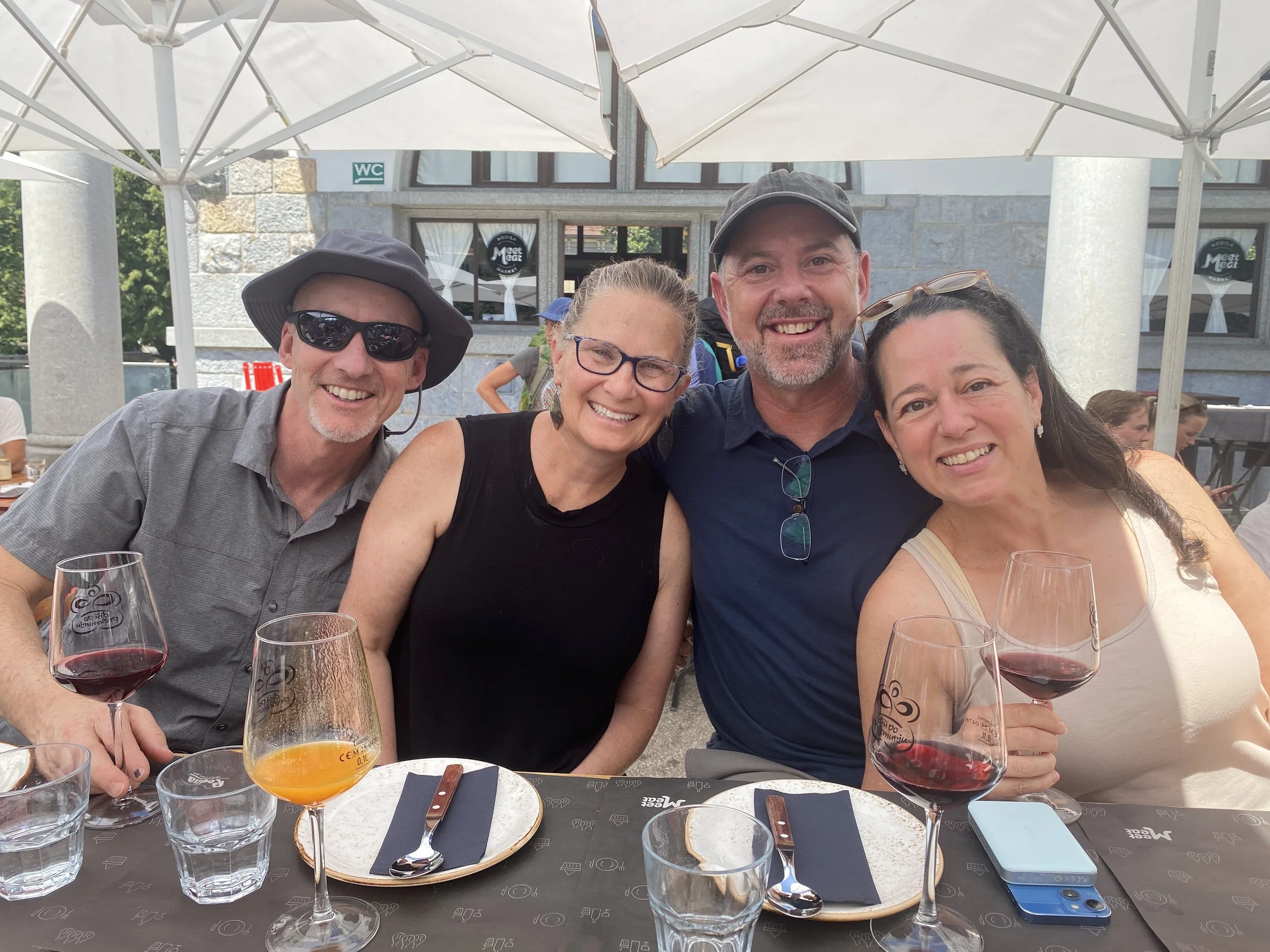 friends enjoying a meal on a food tour in Ljubljana, Slovenia