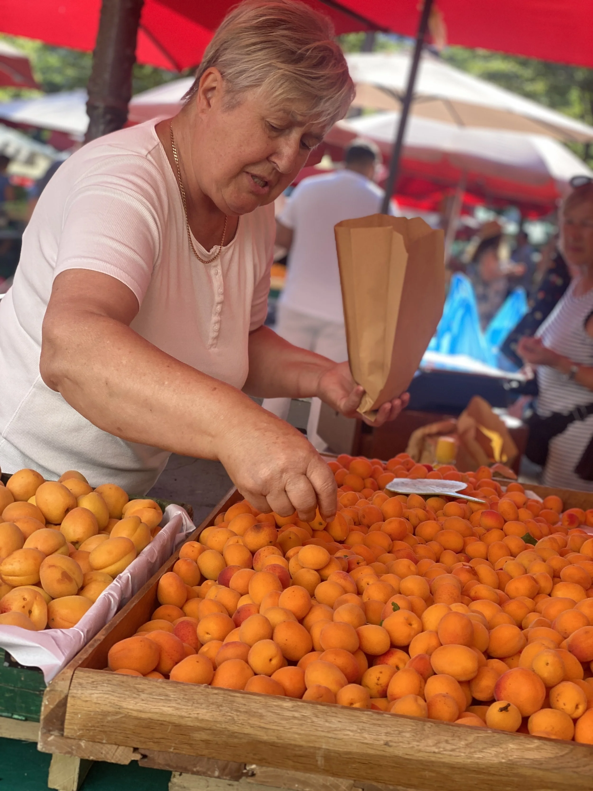 Apricot vendor at Ljubljana's market in Slovenia