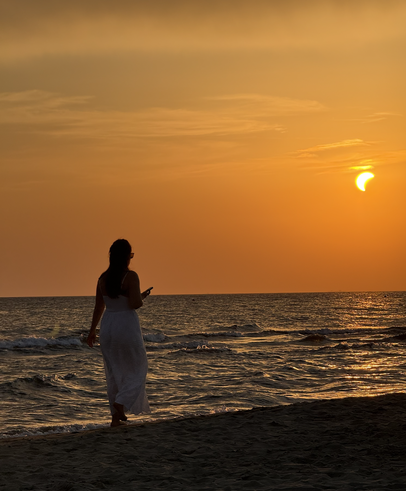 a woman walking at sunset in pietrasanta, an Italian hidden gem