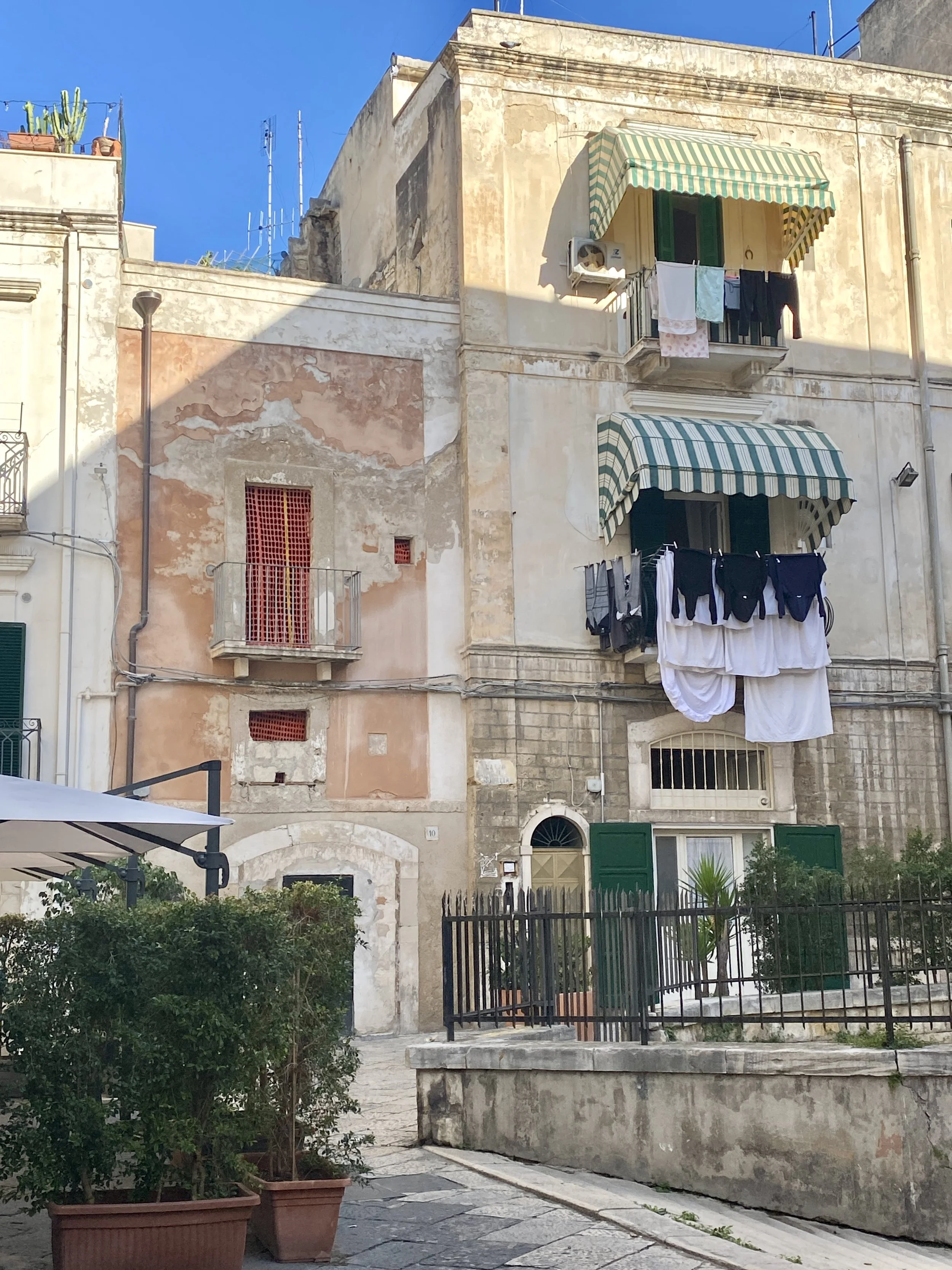 laundry drying from a balcony in bari, puglia