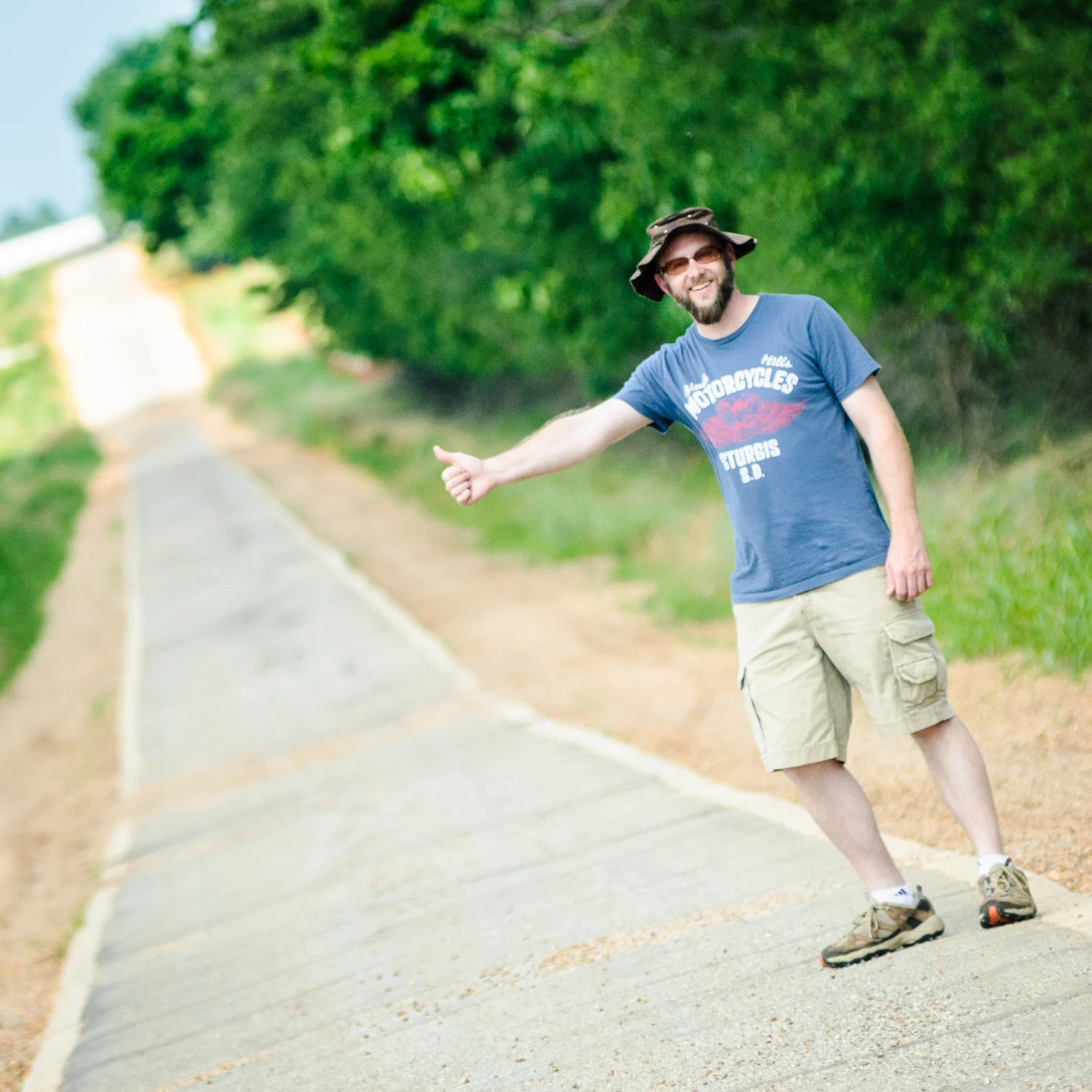 Photographer David J. Schwartz hitching a ride on The Sidewalk Highway Near Afton OK.