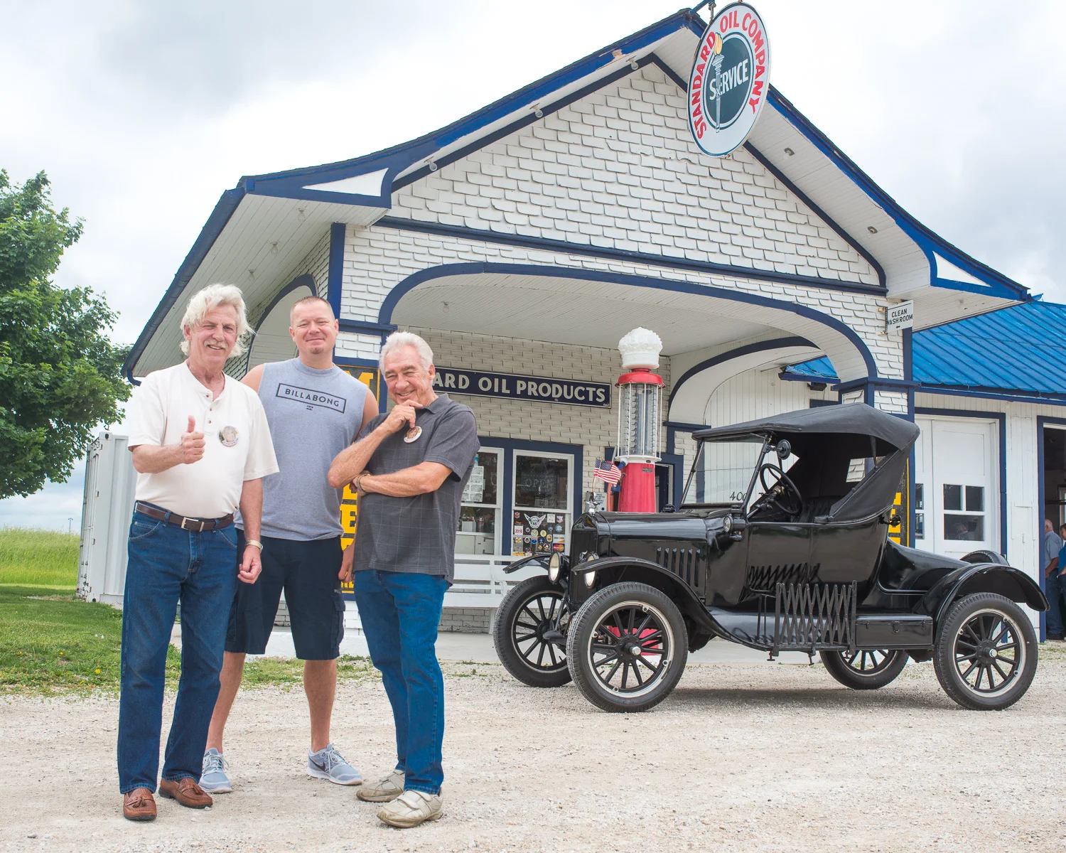 Craig Parrish, the event organizer, John Weiss, 66 preservationist and husband of Lenore, and Terry Joiner, The Mayor of Odell in front of Odell Station with a Ford Model T.