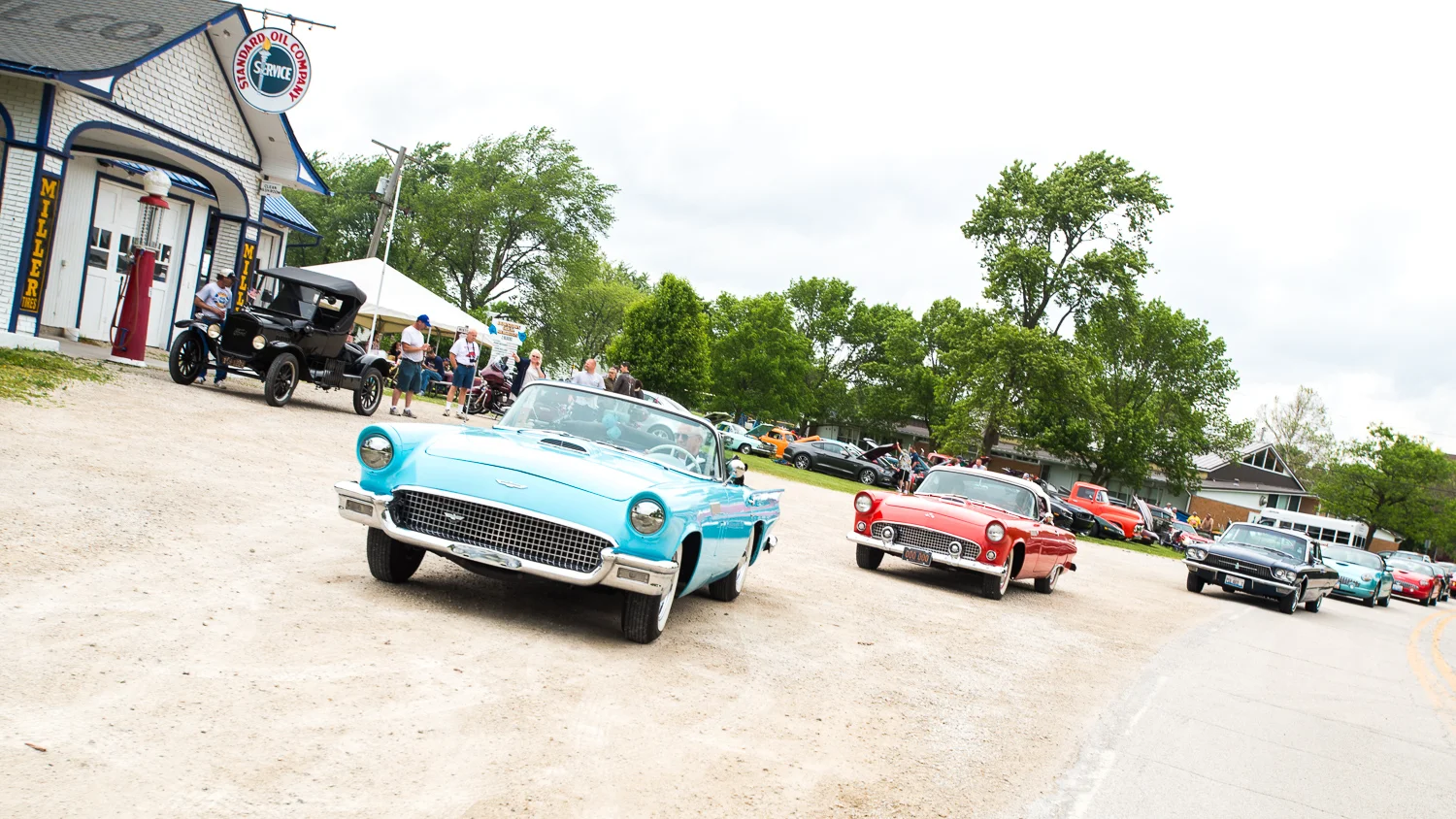 A String of Ford Thunderbirds arriving at The Car Show Benefit.