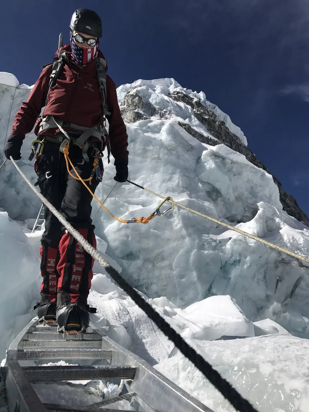 Crossing a crevasse in the Icefall (photo credit Luke Reilly)