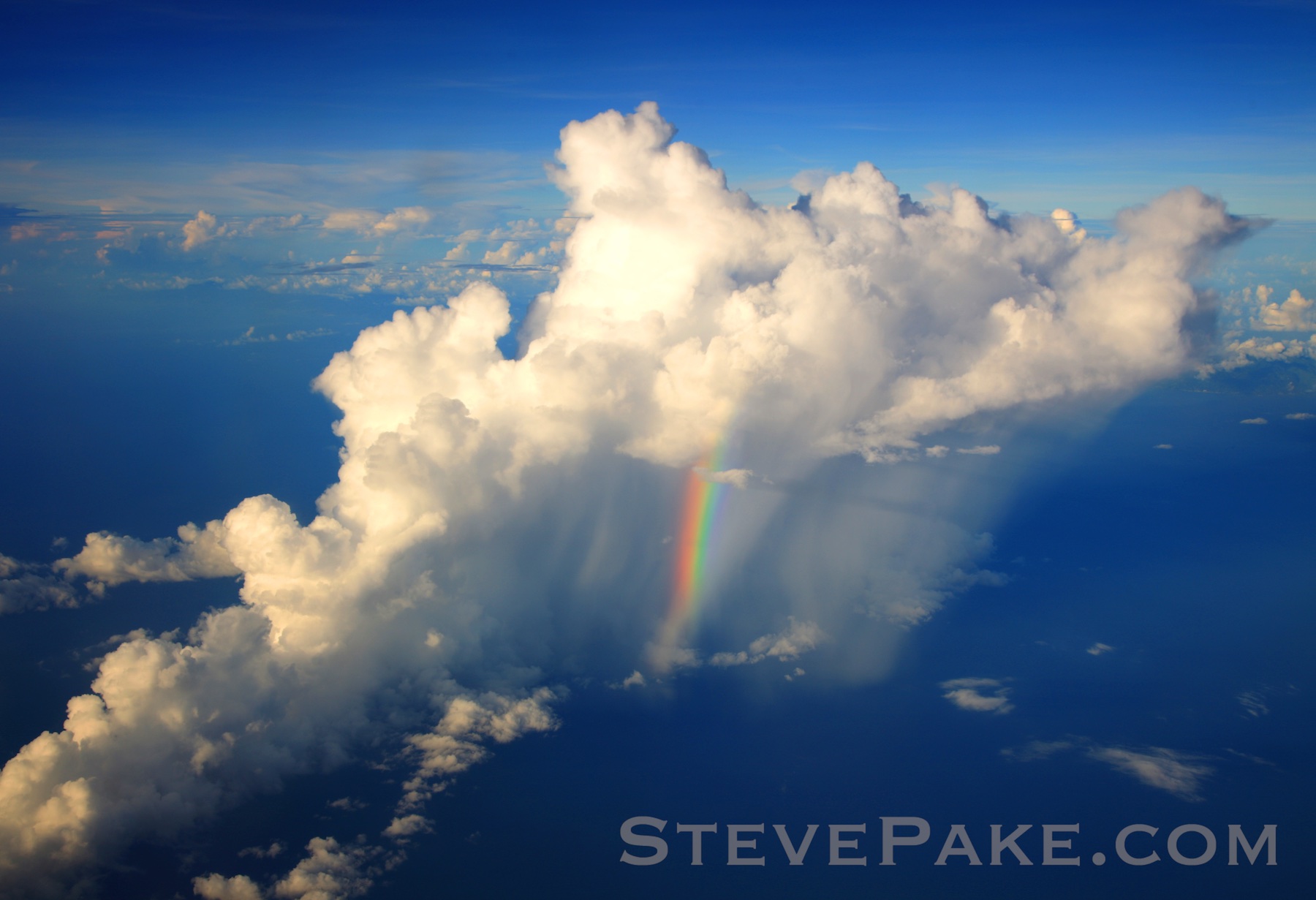 A rainbow in the middle of a tropical shower in the Caribbean from the air, and on our side of the plane. This only lasted a few seconds as we were flying by, and it was spectacular. Always have your camera with you and ready!
