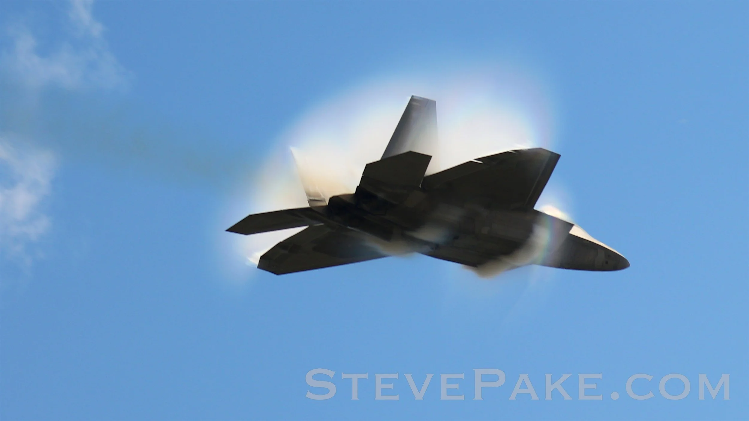 Prize Shot: The transonic F-22 Raptor pass. It's just stunning! This was right over our heads at a focal length of only 135mm, so my cheap 18-135mm kit lens could have gotten this shot! It helps to have top notch equipment, but you don't "need" to have exotic super telephoto lenses to get great photos!!! 