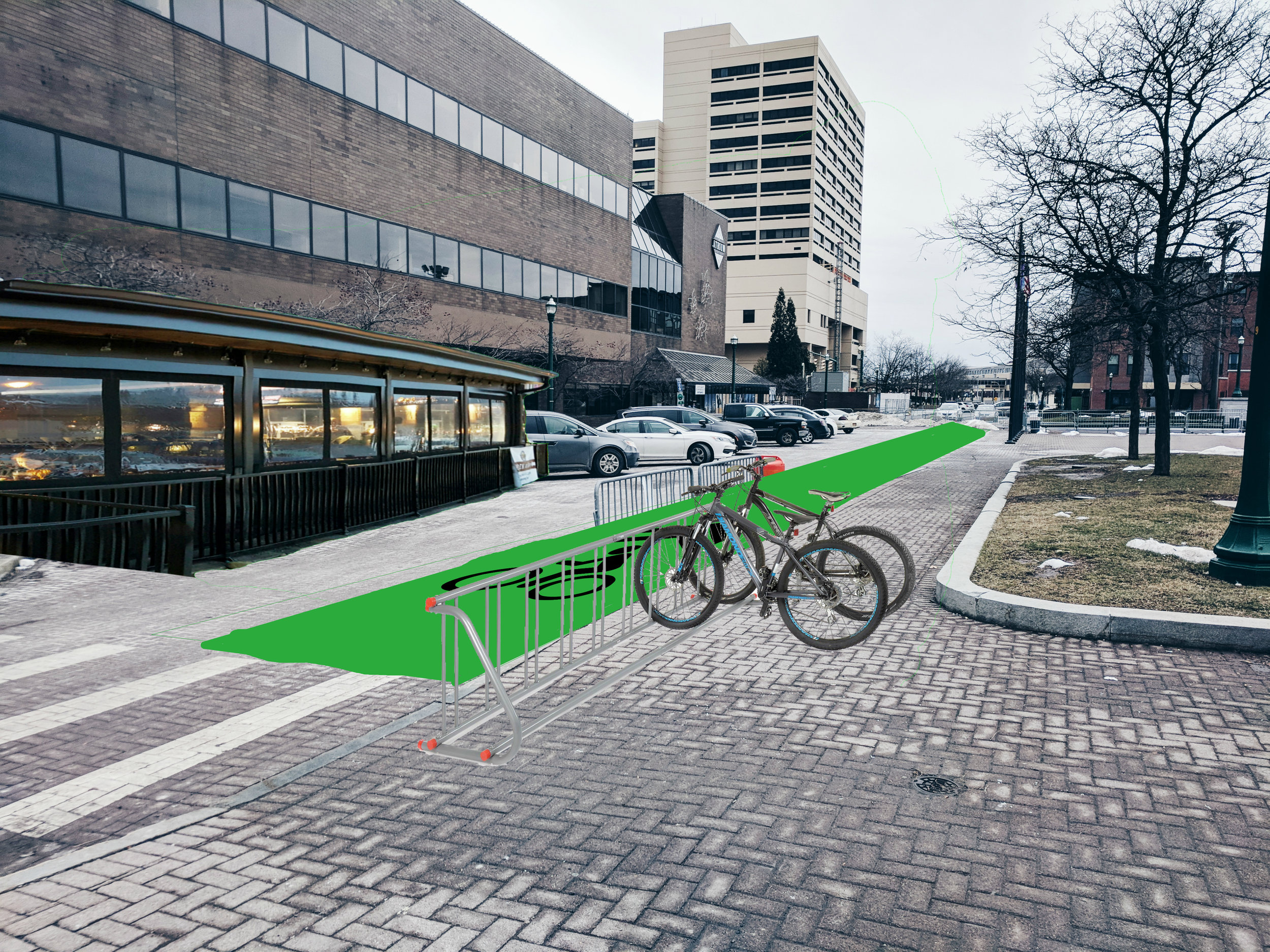  An added restaurant space to bring interest to the square, along with a large bike lane and bike rack to encourage a more active use of space. 