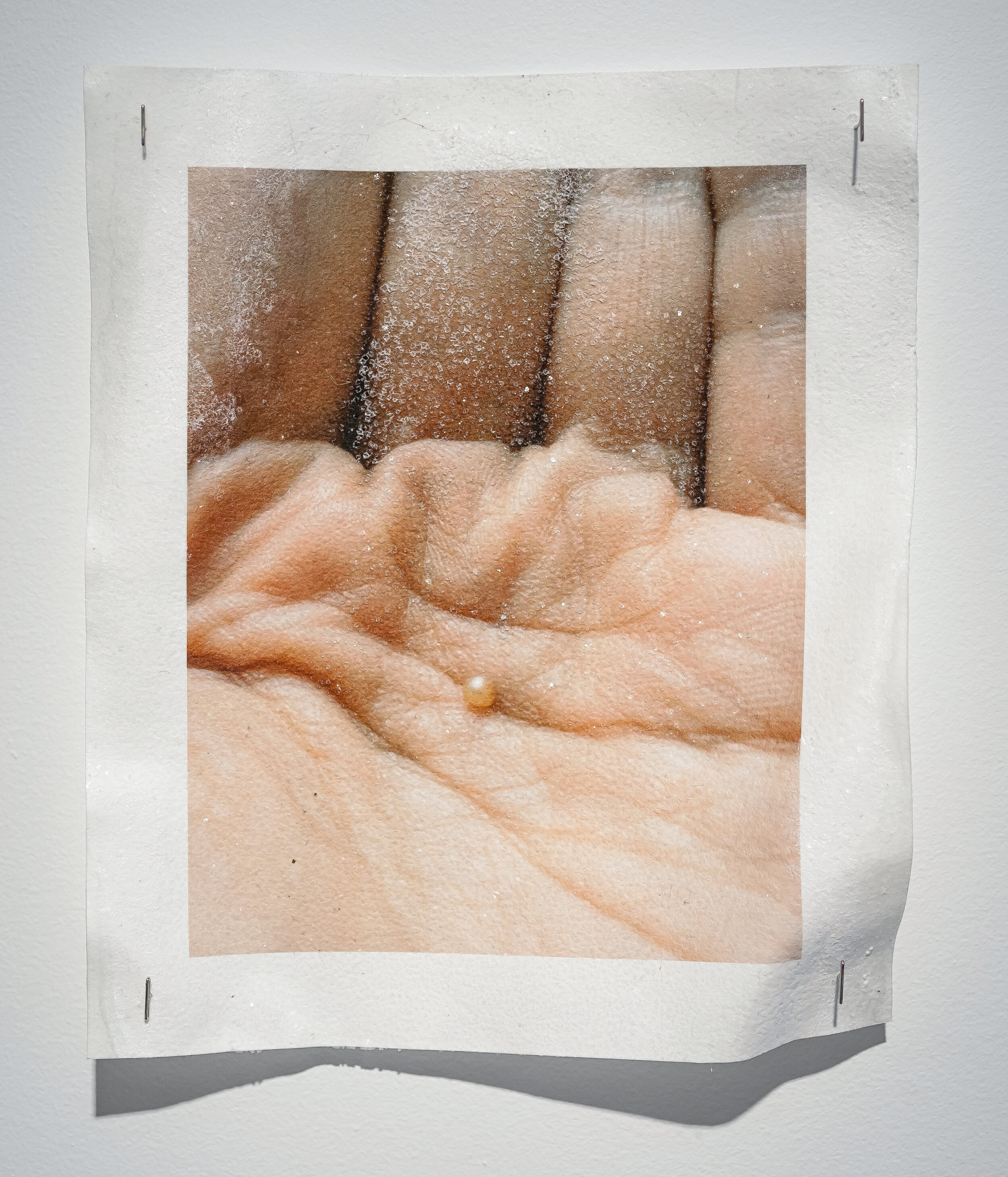  Xan Shian, Pearl found in my mouth while eating a mussel, 2019, inkjet print on archival paper soaked in seawater, salt residue. 