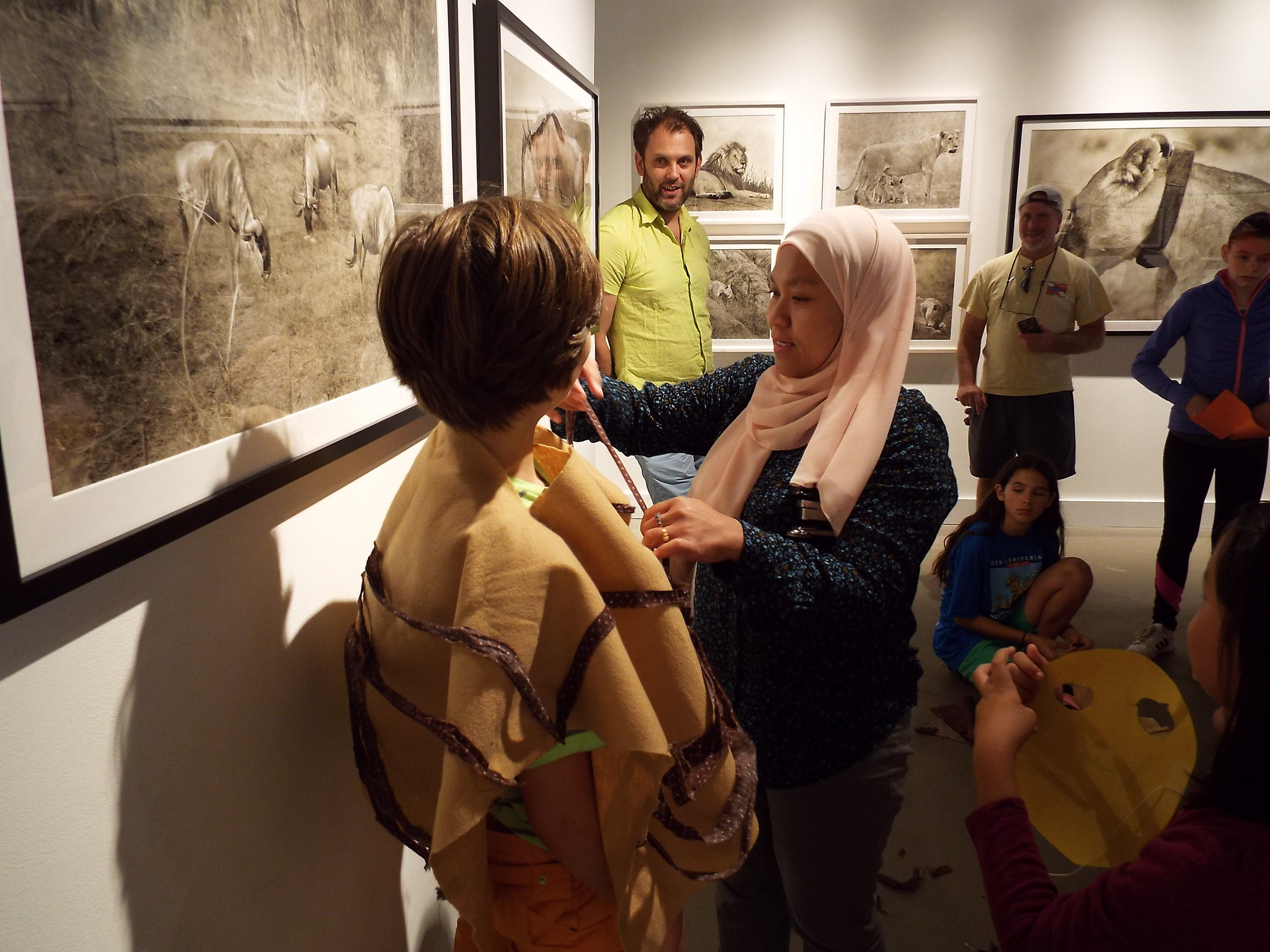  A mom helps kids create costumes during Toto Kisaku's, "Le Petit Studio" 