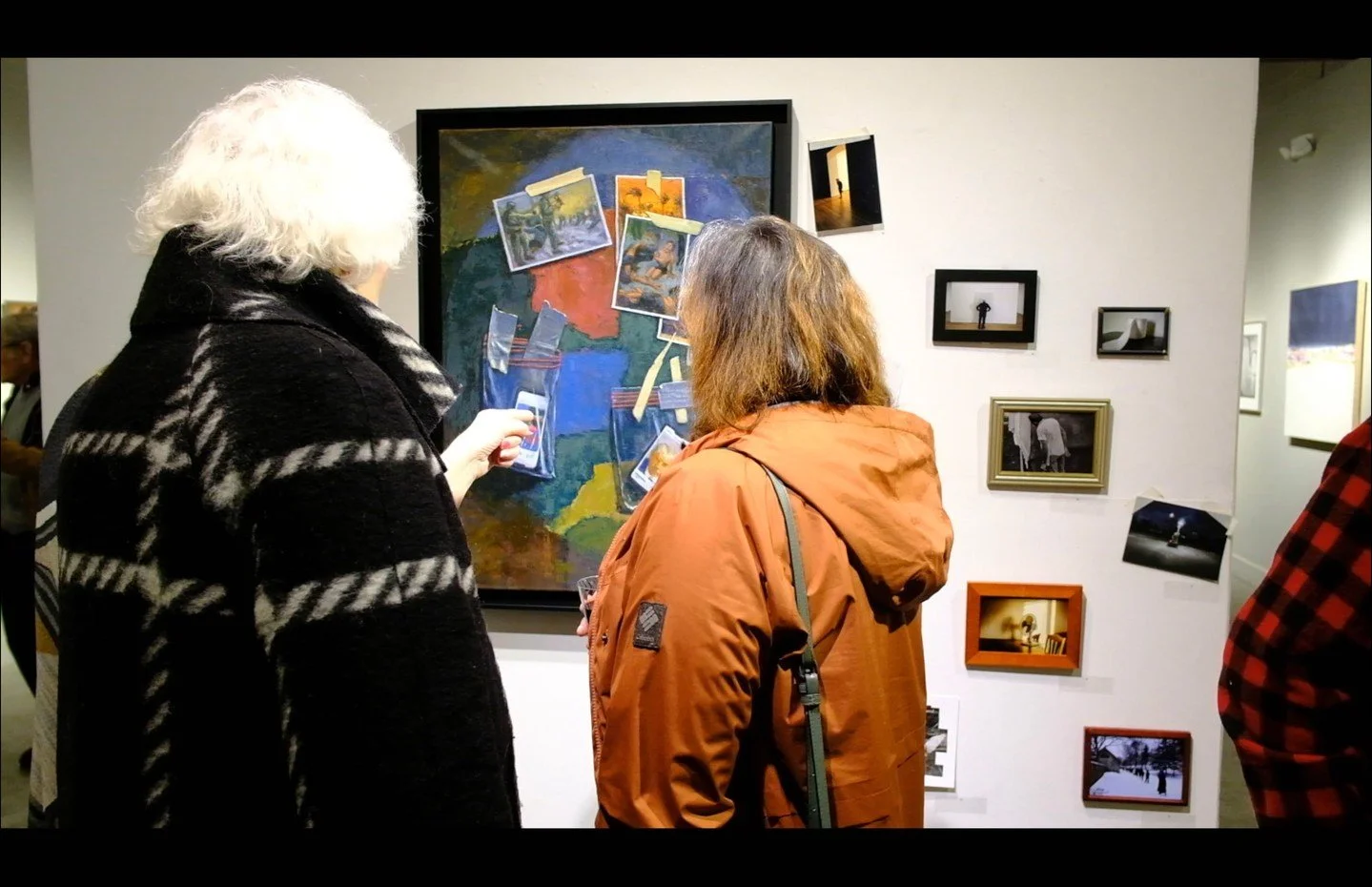 Frank Bruckmann and Sean Kernan are exhibiting their work on the North wall of the gallery in a dialogue. Bruckmann painted taped up photos in the style of trompe l'oeil and Kernan spilled onto the wall with his actual photos, adhered with actual tap