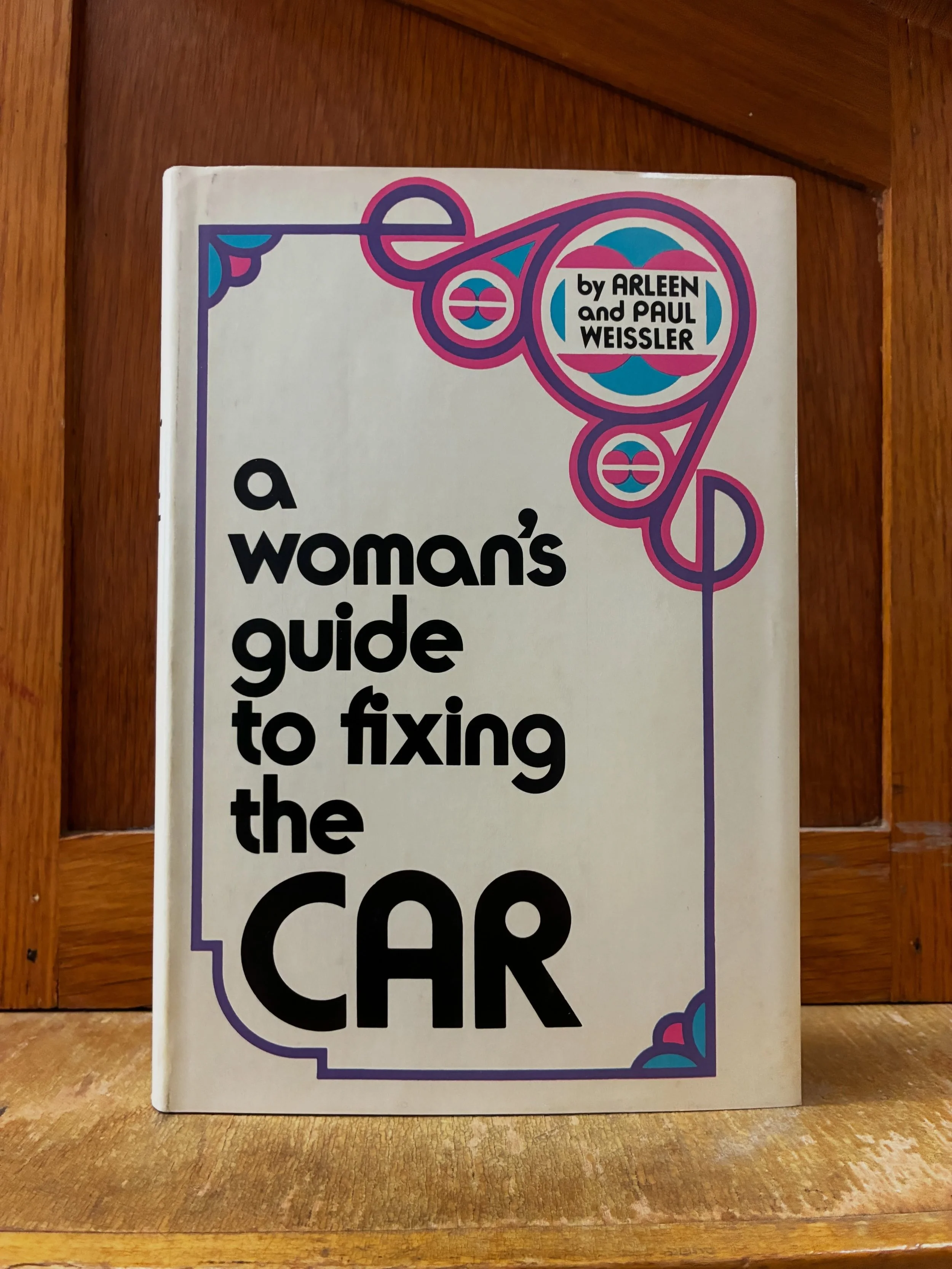 A Woman&rsquo;s Guide to Fixing the Car, by Arleen and Paul Weissler. A 1973 guide for the modern woman. 

&ldquo;How can a woman be truly liberated if she doesn&rsquo;t know a cam from a gearshift?&rdquo;

$8.50 in hardcover, look for it by the stor
