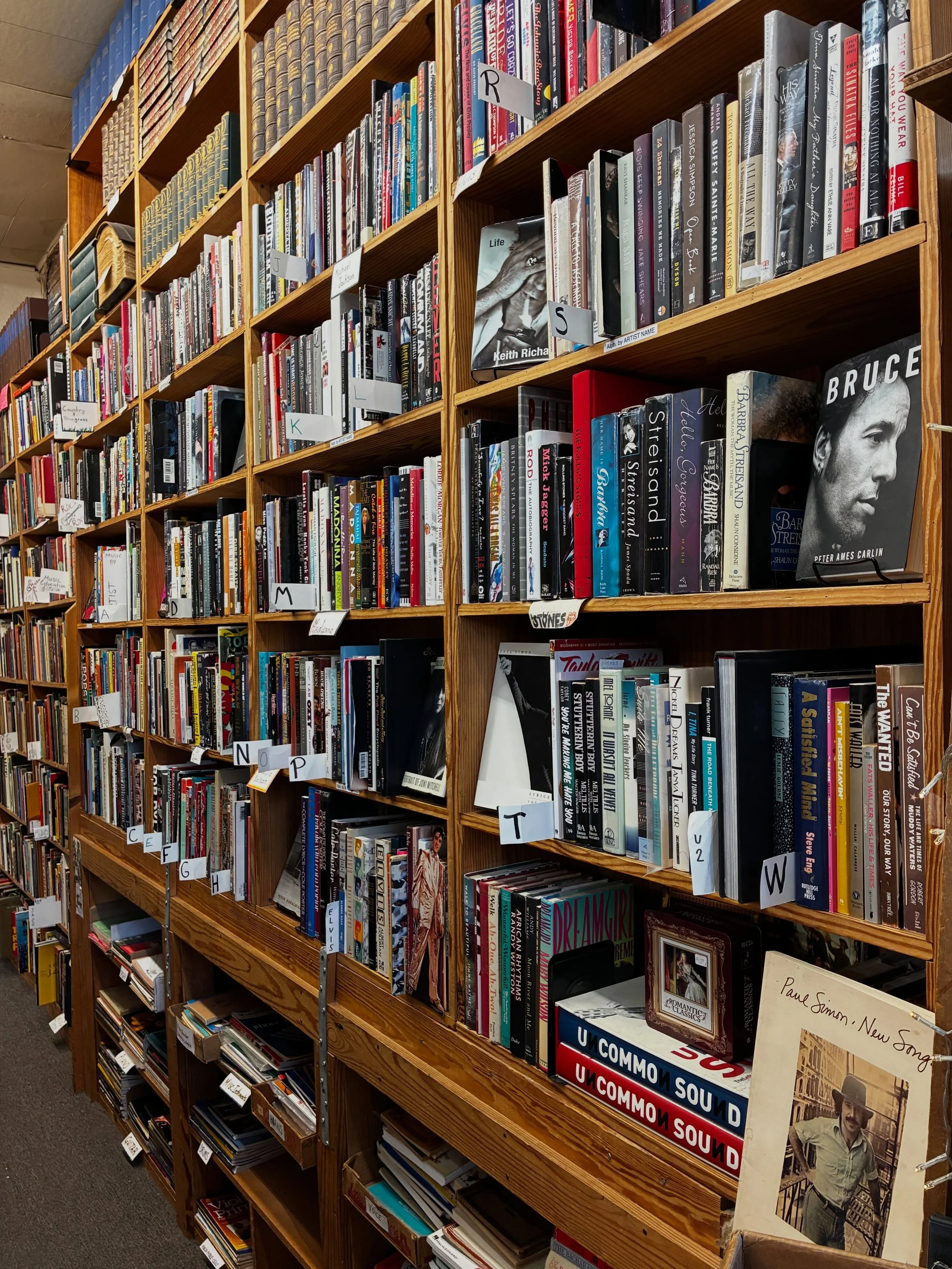 We recently found a large cache of music books in our backroom and have been working hard to get them out on the shelf these past couple weeks. Lots of new books on our Music wall now, stop by and check them out!