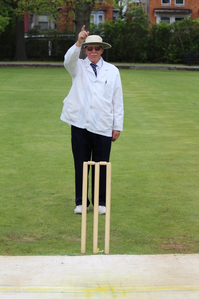 Umpire responds to the appeal by sticking a finger in the air, signaling the batsman is out Leg Before Wicket. (Photo by Ewart Rouse. All rights reserved.)
