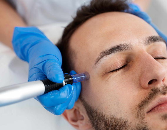 Smiling aesthetician performing a facial treatment on a male client to improve skin texture and reduce razor bumps.