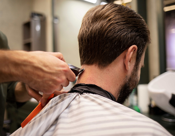 Man receiving a precision men’s haircut with blow-dry styling at Chicago Male Salon in Buena Park