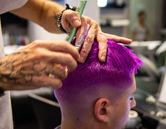 Man with freshly styled light hair showing natural tone enhancement from professional hair color in Buena Park.