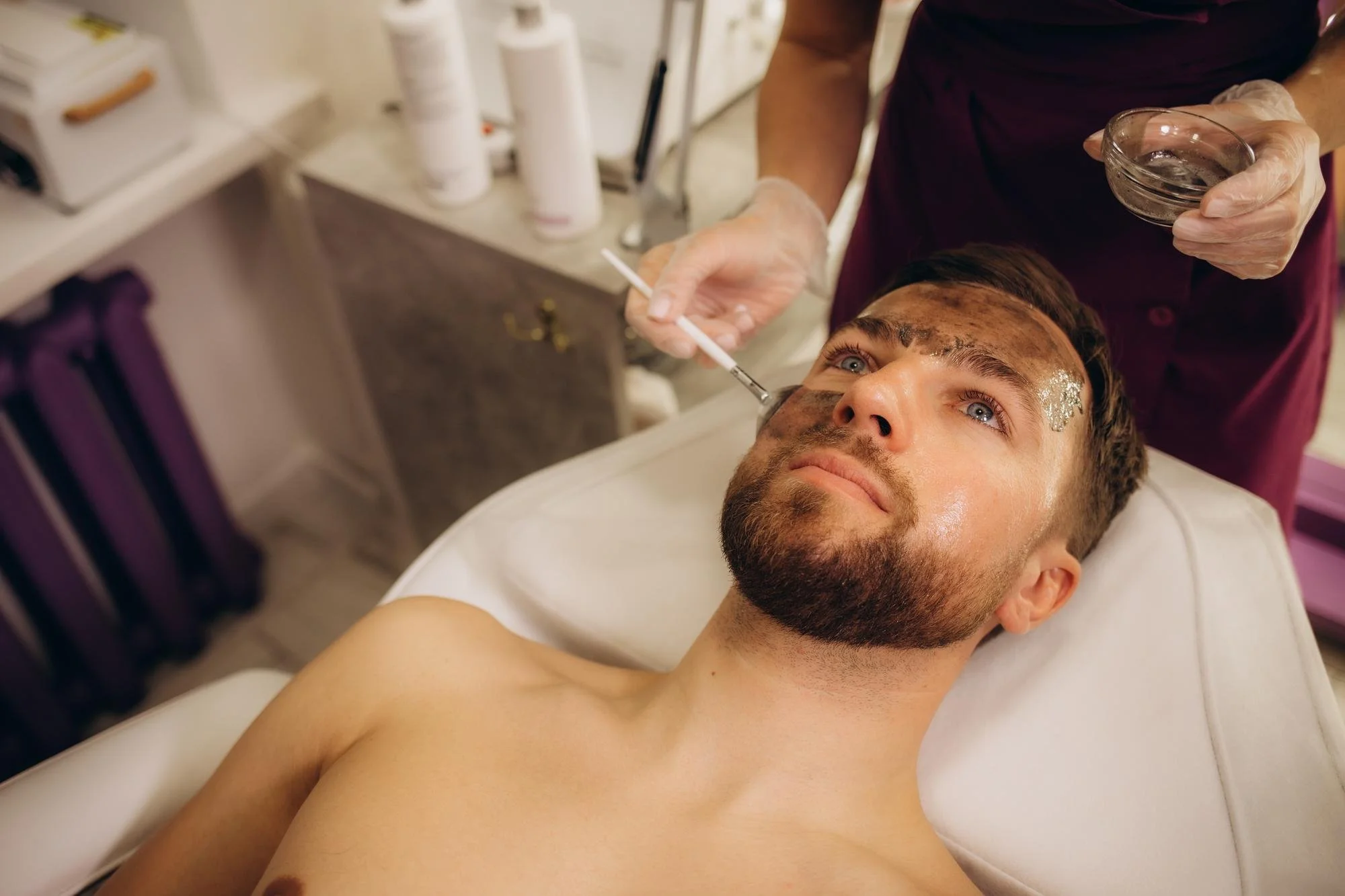 Patient in clinic during an advanced treatment illustrating different peel levels in a professional skincare setting.