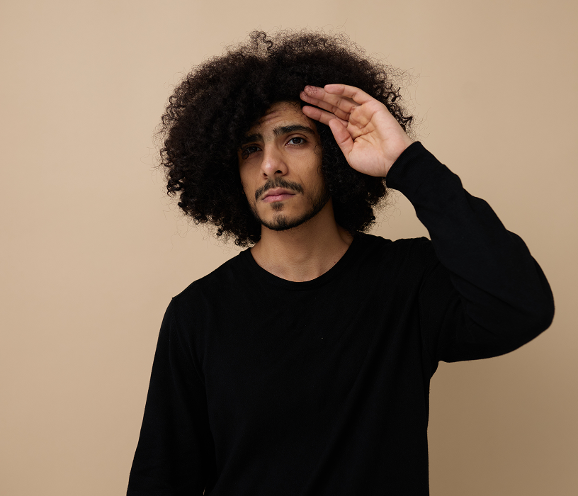Man with short straight hair and beard before a textured perm men consultation to add curl and volume