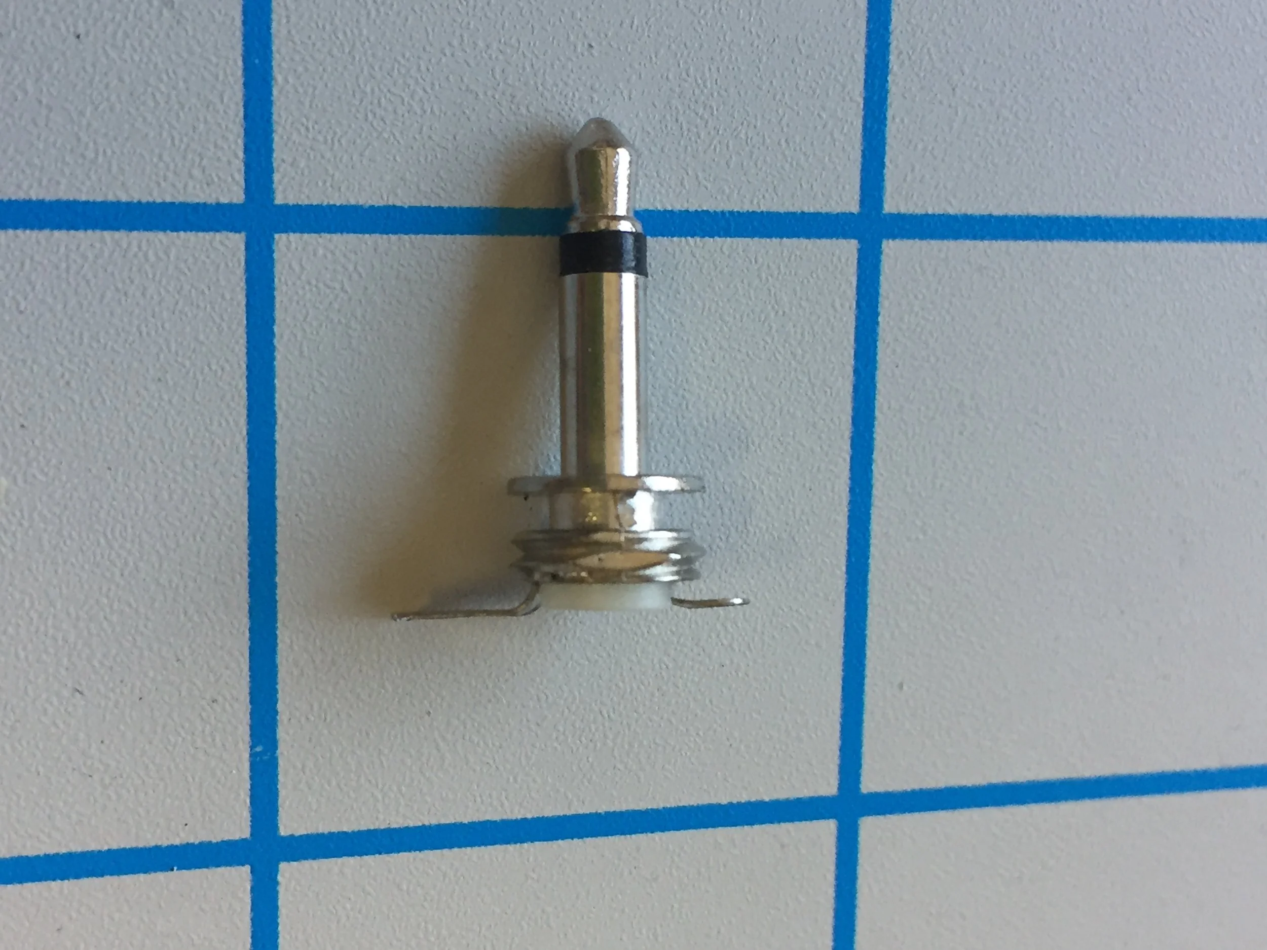 4.  Each connection lug should be inline with the bottom of the plastic after being bent so that it will stand flat and upright on the backside of the AllFlesh pcb surface. Note that the smaller solder lug has space between it and the underside of the body of the plug, this is important as it makes sure you don't introduce extra ground noise into your patch. Avoid spanning this space with solder during the soldering process!