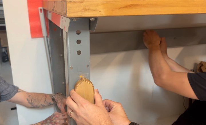 three ppl using three Ferrous&rsquo; against magnets (on an steel legged desk) for greater vibrations with heavy objects. a musical construction site. next example: magnets sandwiching a packing peanut bin vibrated by Ferrous w/ a doomed computer pho