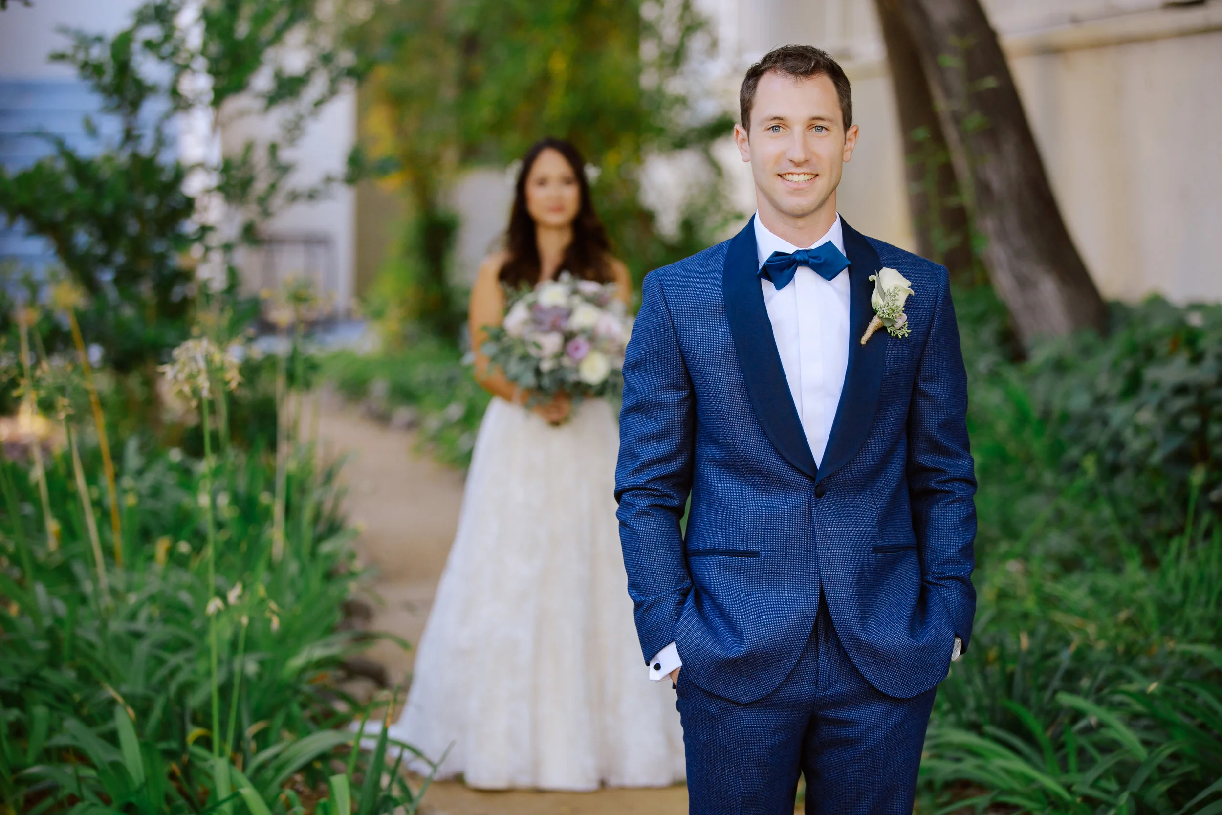 C&M Groom first look on the garden path.jpg