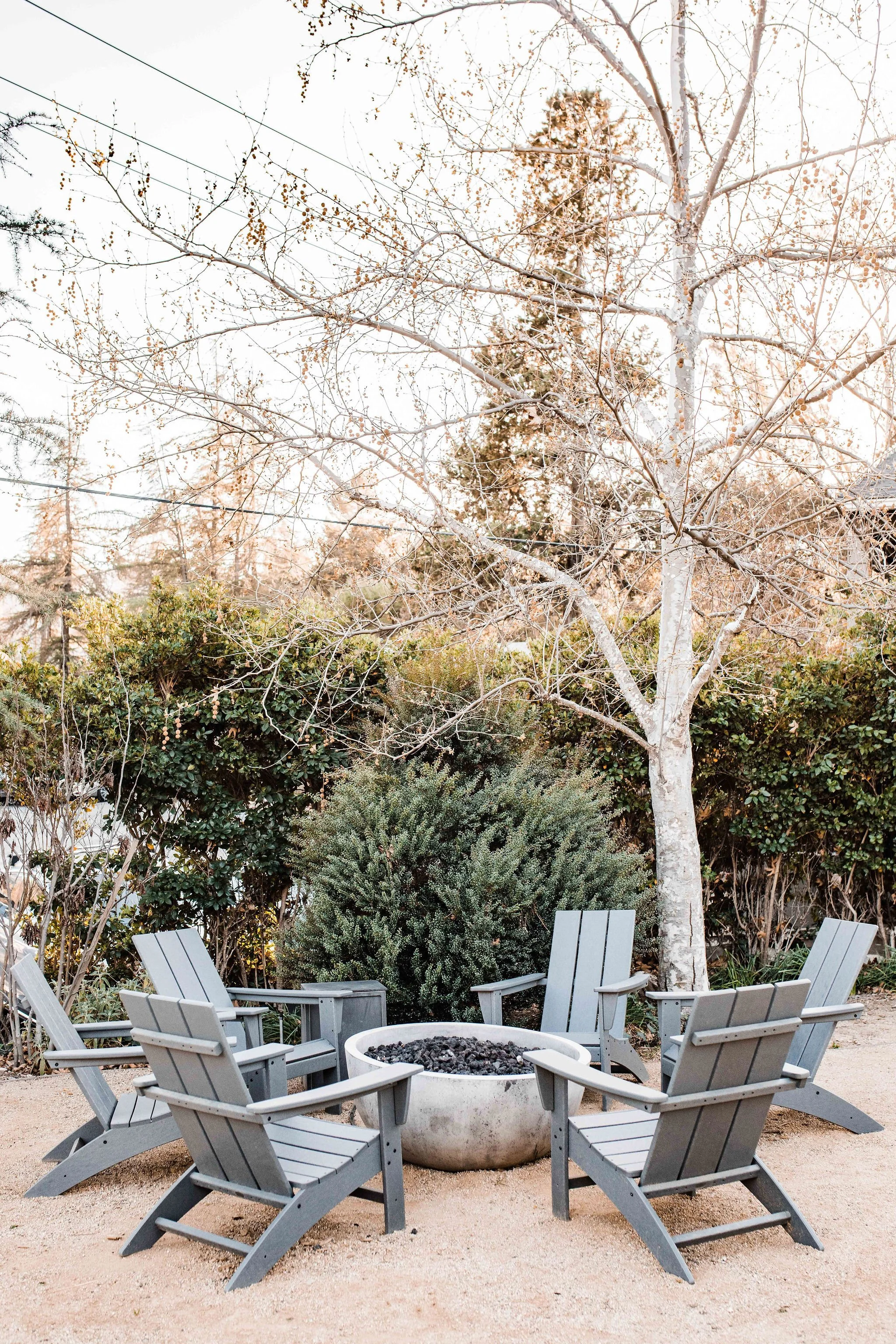A firepit surrounded by chairs on the grounds of The Lodge at Malibou Lake wedding venue in Los Angeles.