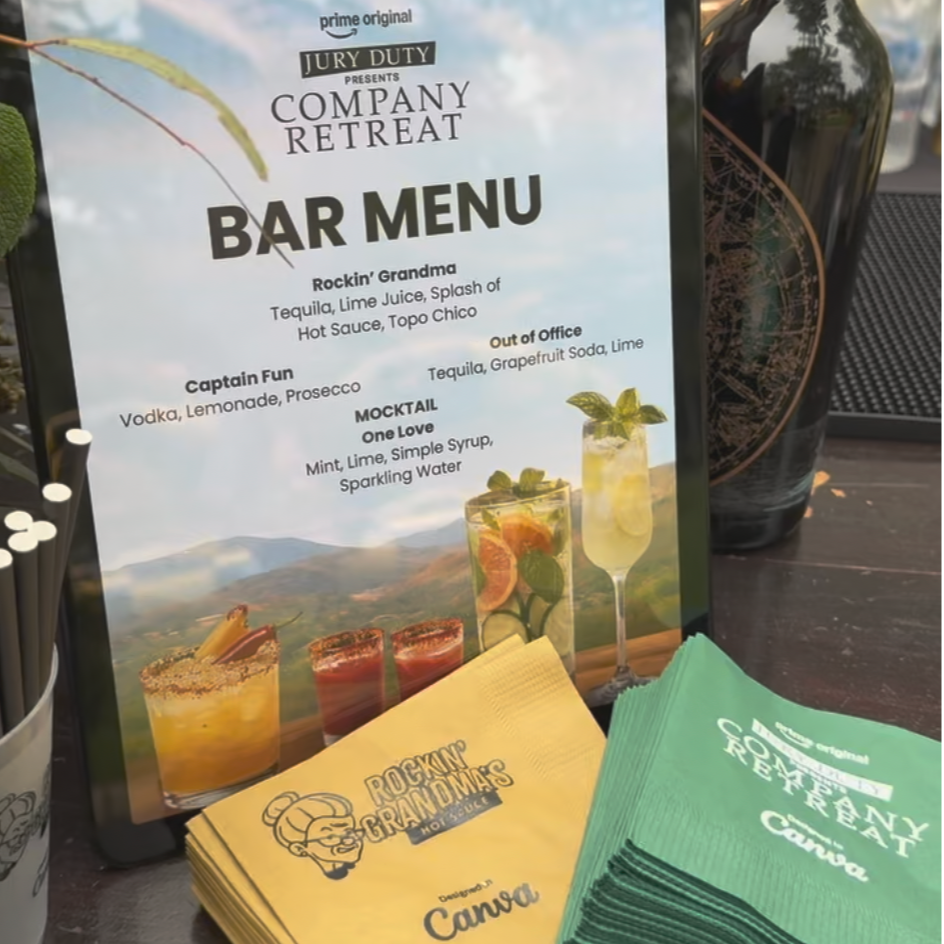 Bar menu screen at a company retreat, featuring drinks like Rockin' Grandma, Out of Office, Captain Fun, and Mocktail One Love, with ingredients listed for each drink.