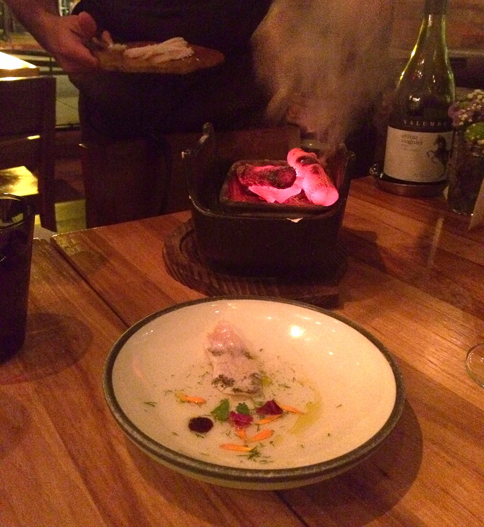 yellowtail served on binchotan, midorizu, flowers