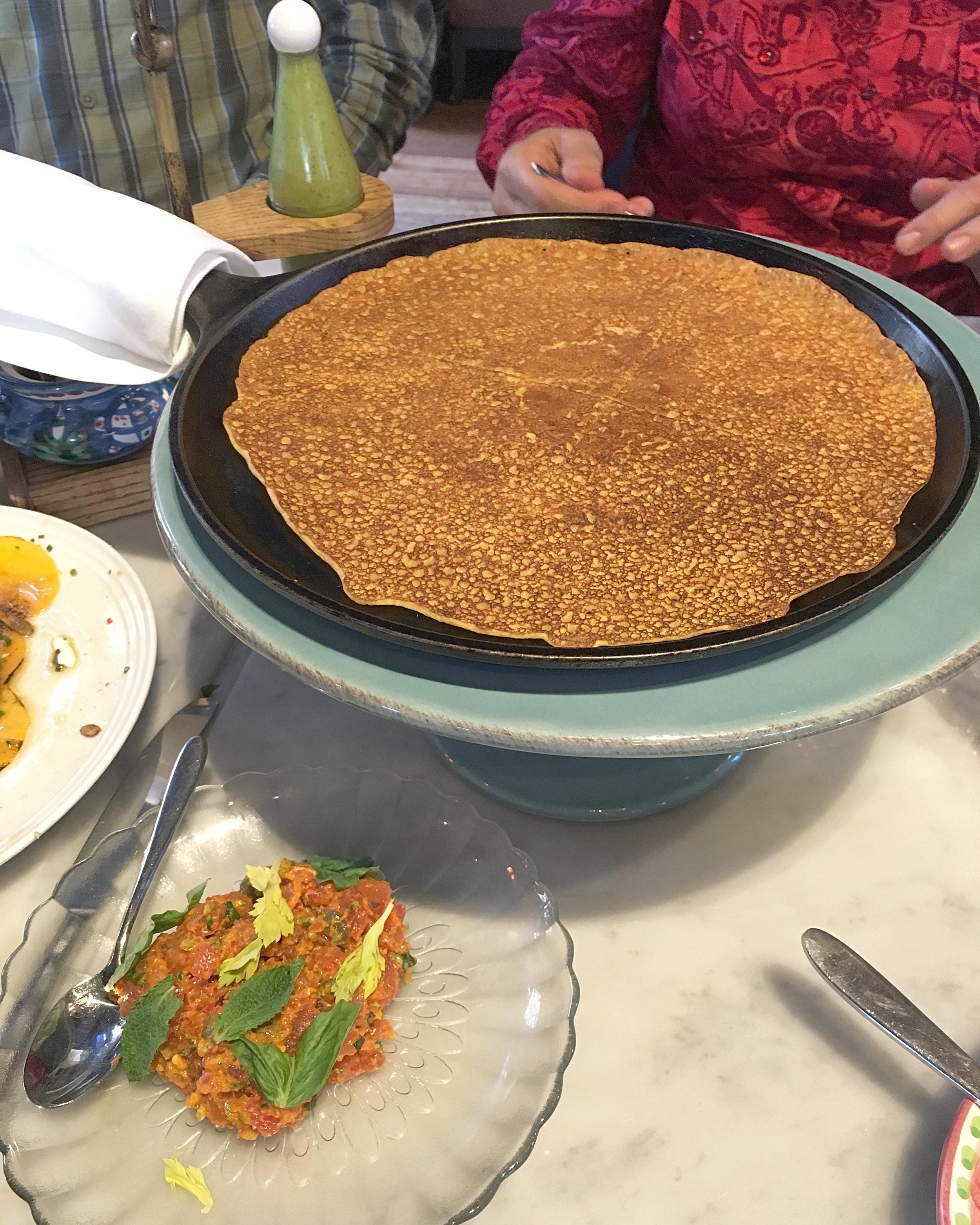 cecina (chickpea pancake), spicy calabrian tuna tartare, avocado salsa verde