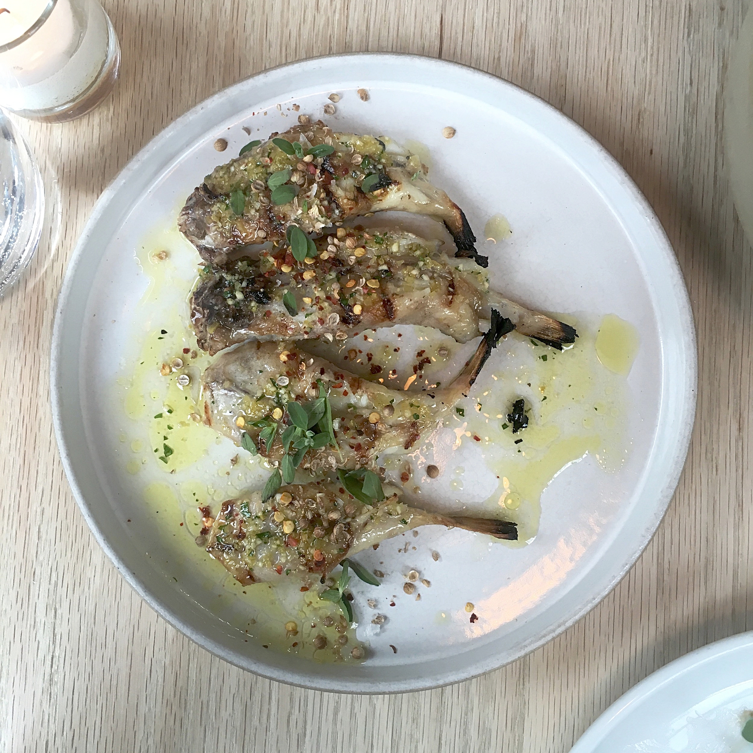 grilled blowfish tails, salmoriglio, cracked coriander