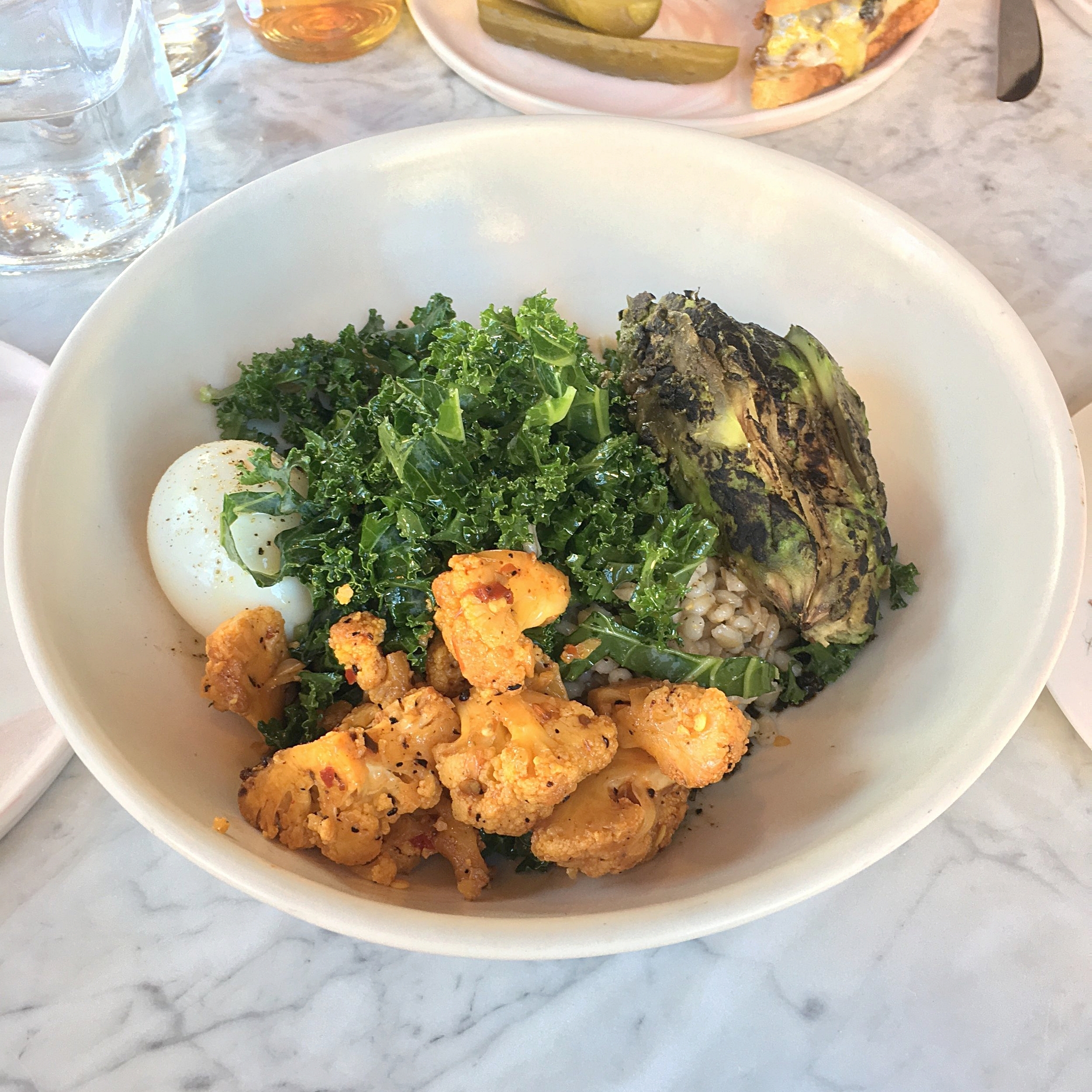 grain bowl // toasted barley, boiled egg. spicy cauliflower, mustard greens, kale, charred avocado