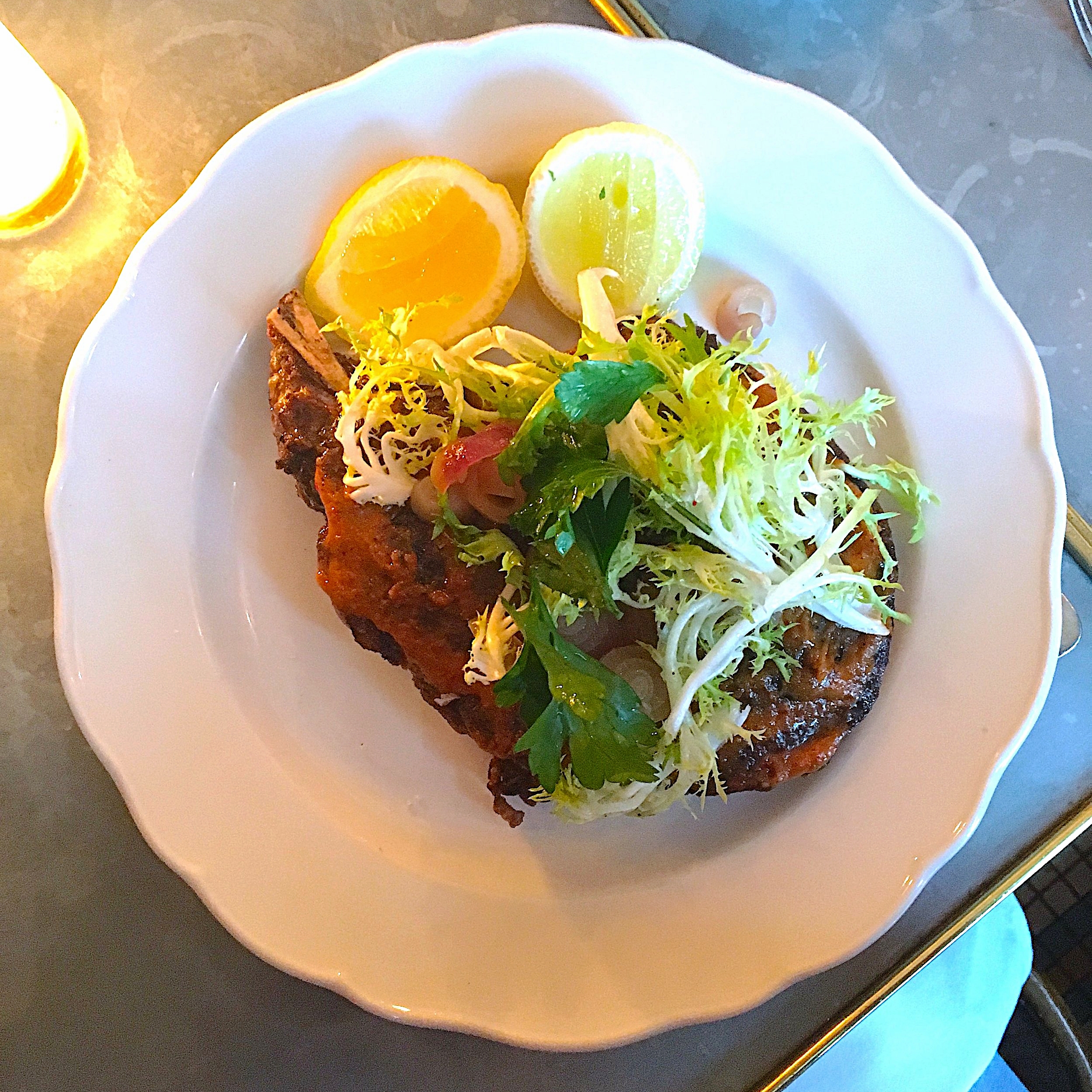 dry-aged rib eye, frisée salad, lemon