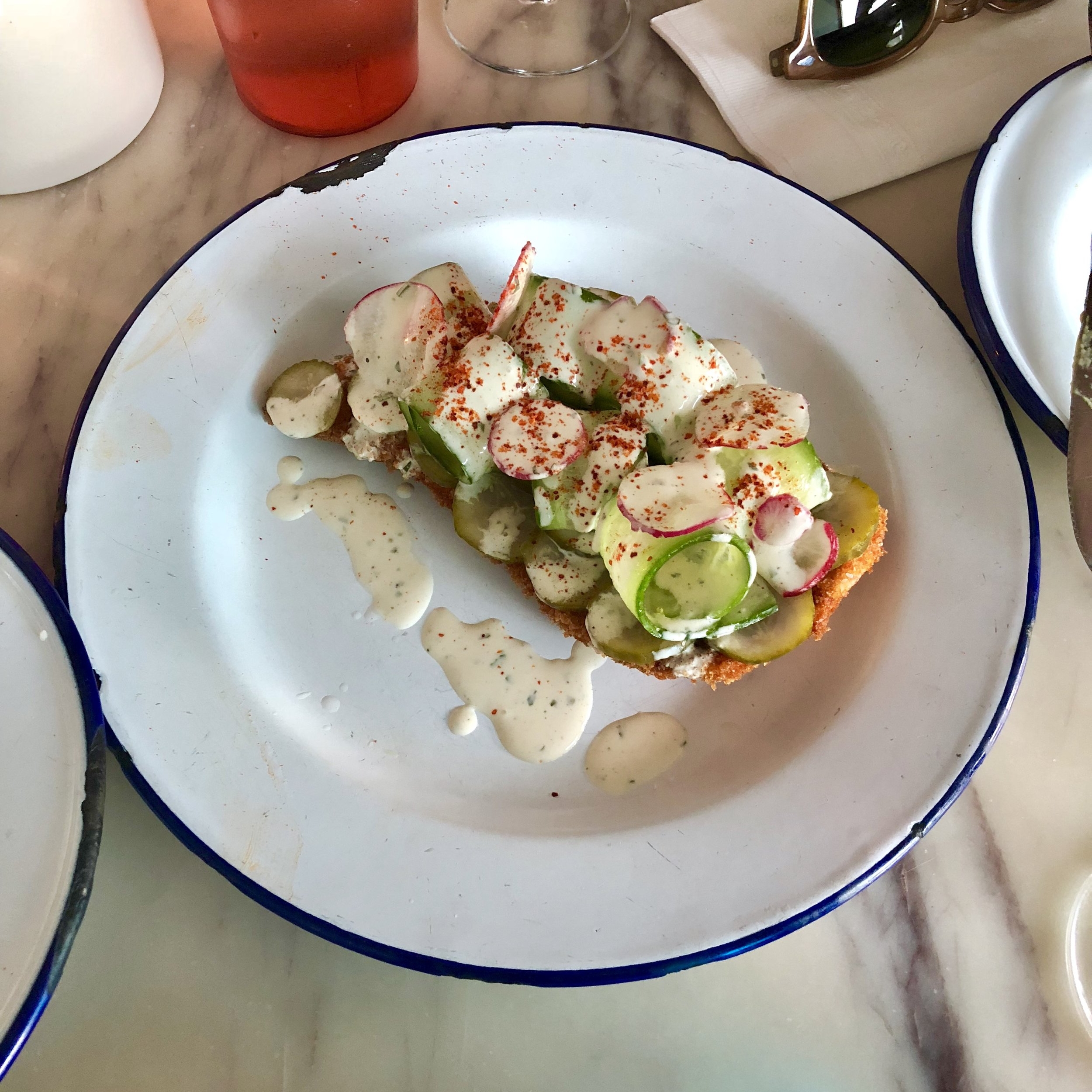 chicken milanesa, raw & pickled cucumbers, maggi ranch