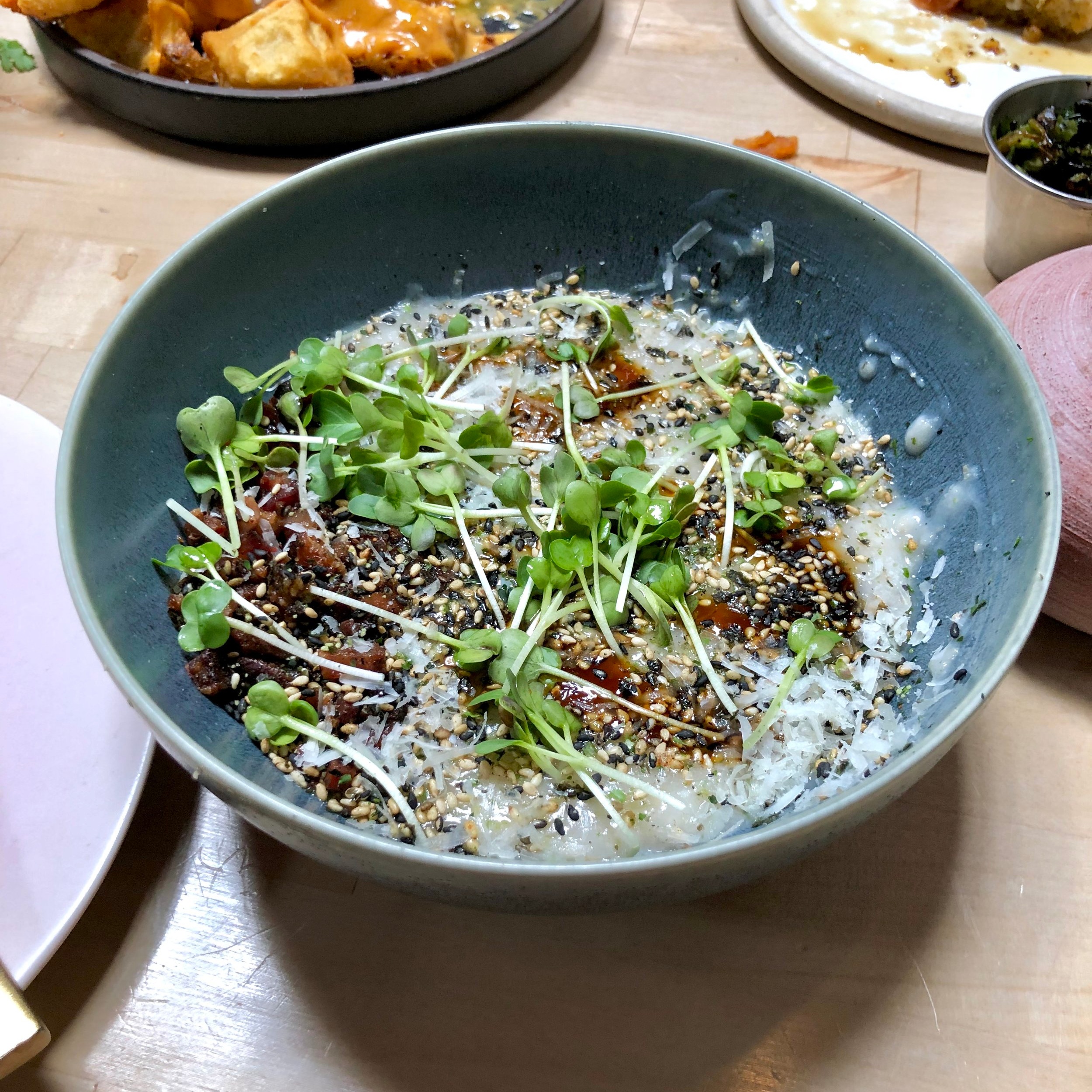  oatmeal congee carbonara // crispy bacon, poached egg, scallion, pecorino furikake 