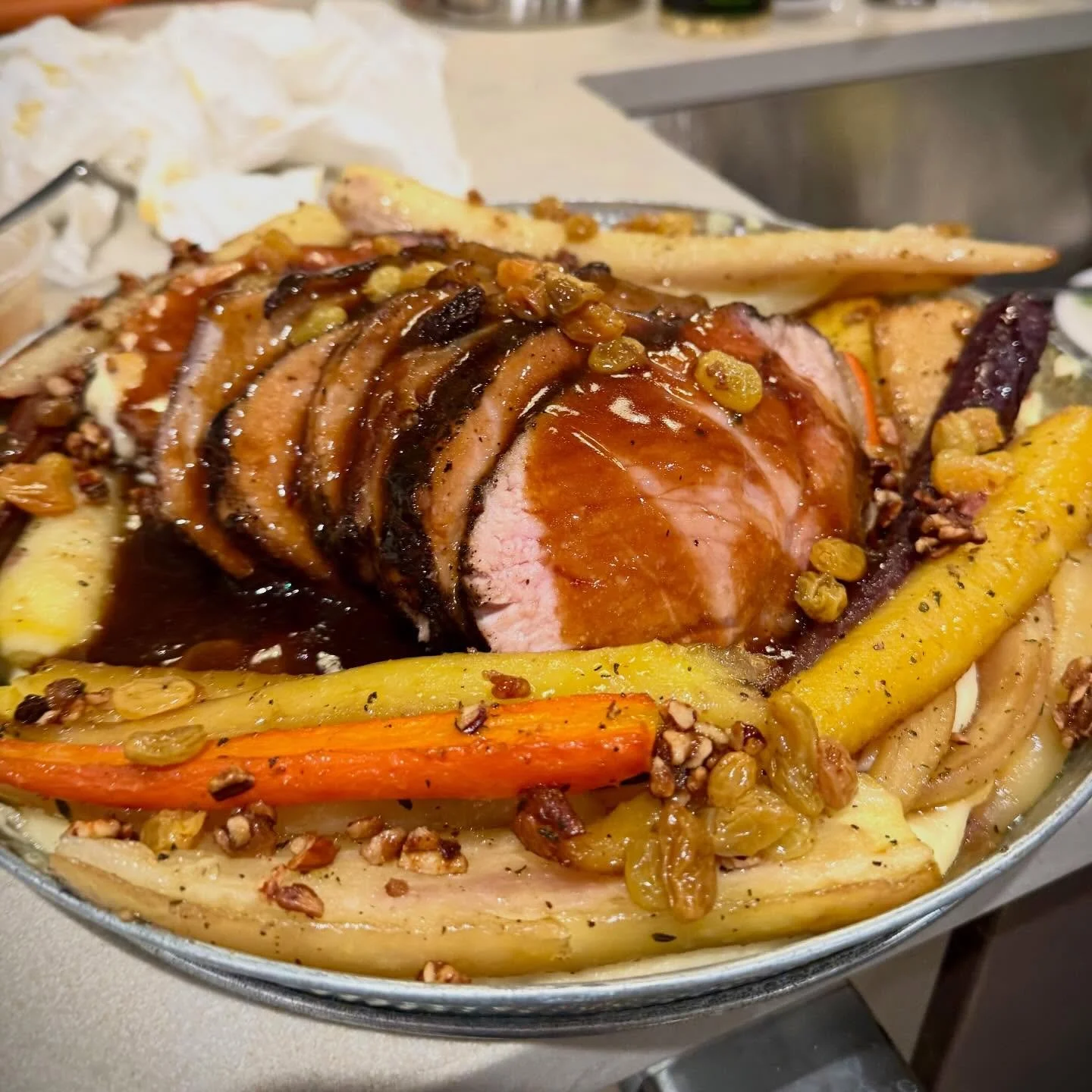 Espresso-rubbed aged pork loin over a silky smooth parsnip potato pur&eacute;e, honey-roasted heirloom carrots, golden raisin Agro dolce, toasted pecan crumble, and an espresso pork jus that you could 100% just drink straight.

Eat Dank Food. ✨