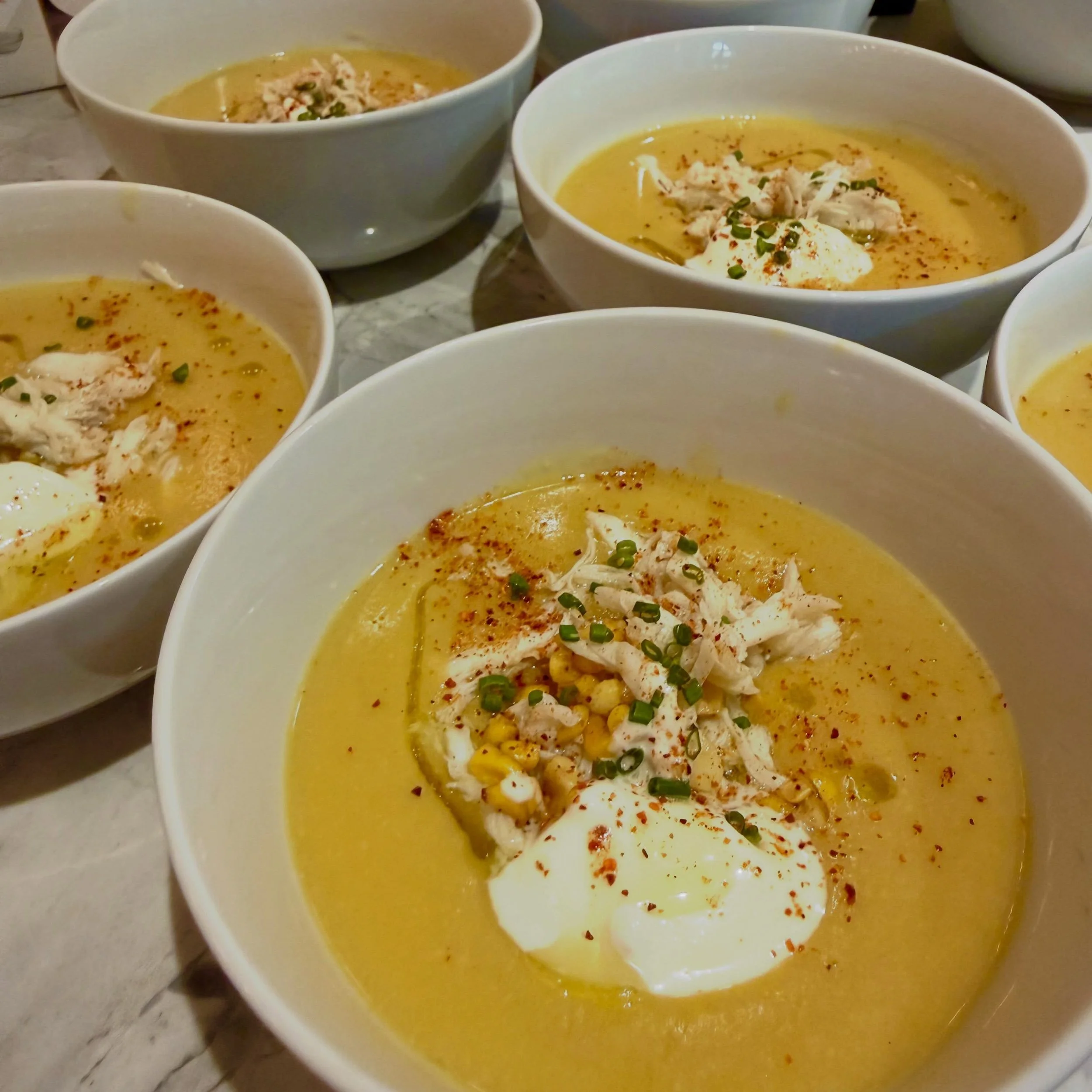 Baby, it&rsquo;s corn season. 🌽

Sooo &hellip; I made corn three ways in one bowl.

Corn stock simmered down low, then blended with sweet corn until it turned frothy with coconut milk and cream - the essence of corn, layered on itself into a perfect