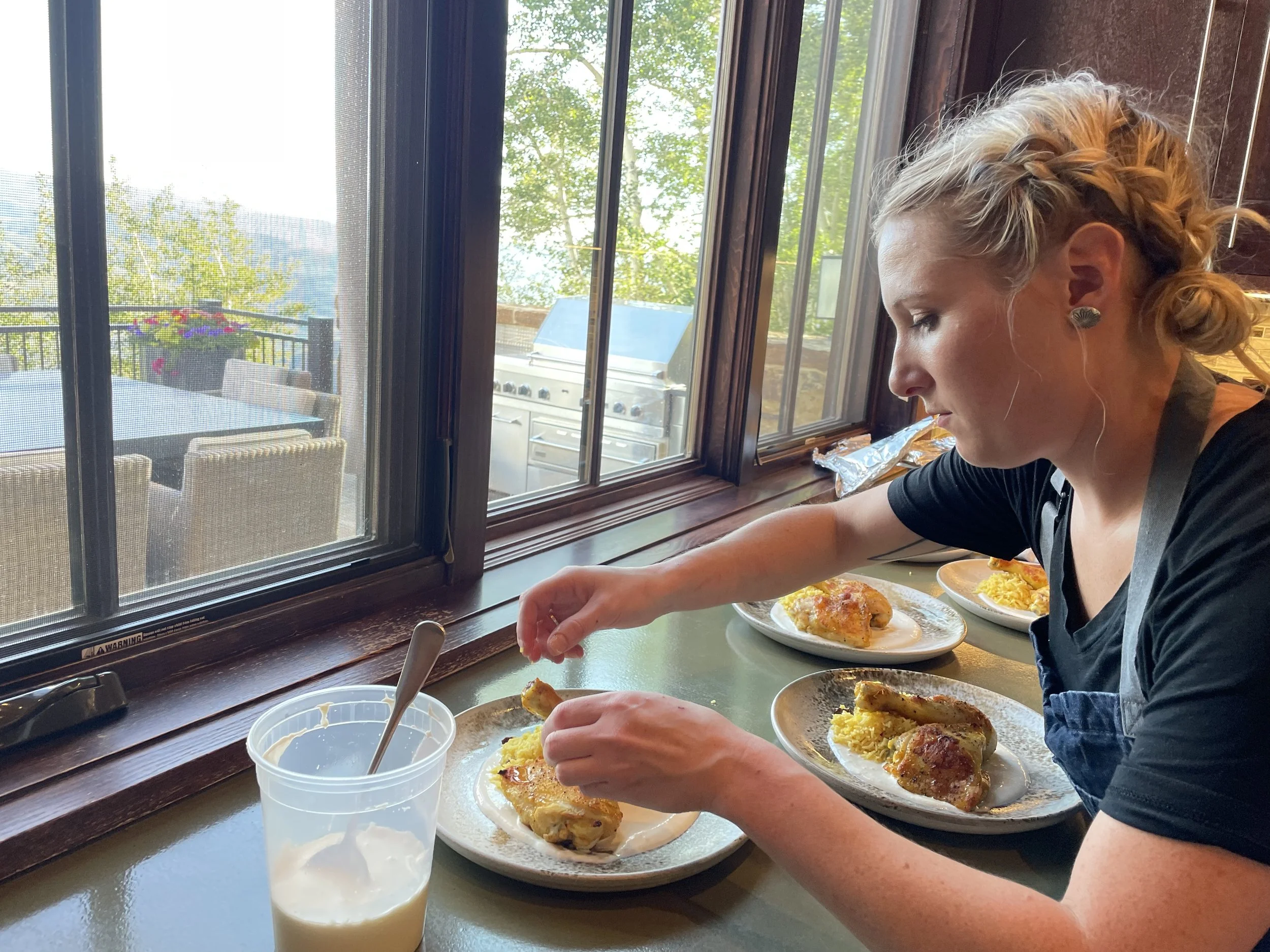 Chef Shelby Lewis plating dinner in Beaver Creek