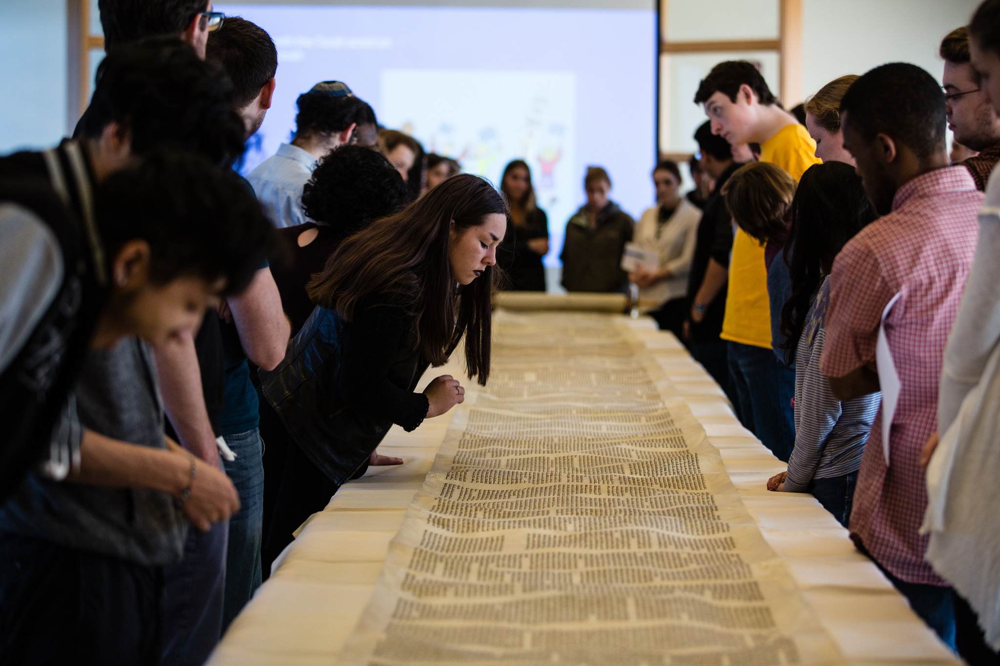 Students see a Torah scroll hundreds of years old at Loyola University Chicago . Photo Courtesy of the University. 