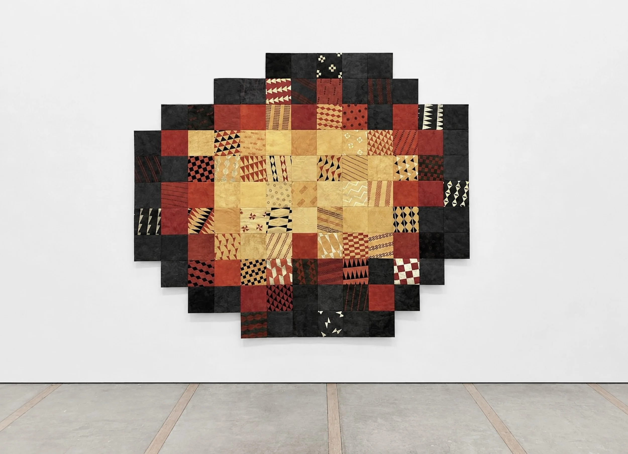 Kiliwehi. Kapa, natural plant dyes, wildfire charcoal, ochre pigment, metal leaf, thread. 101 inches H x 118 inches W. 2026.